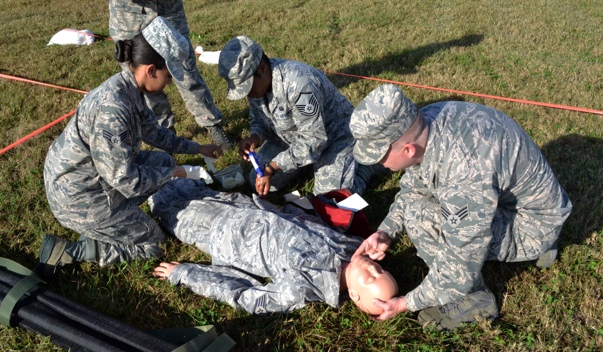 U.S. Air Force Airmen participate in a self aid buddy care exercise as part of Valiant Eagle 2013. 