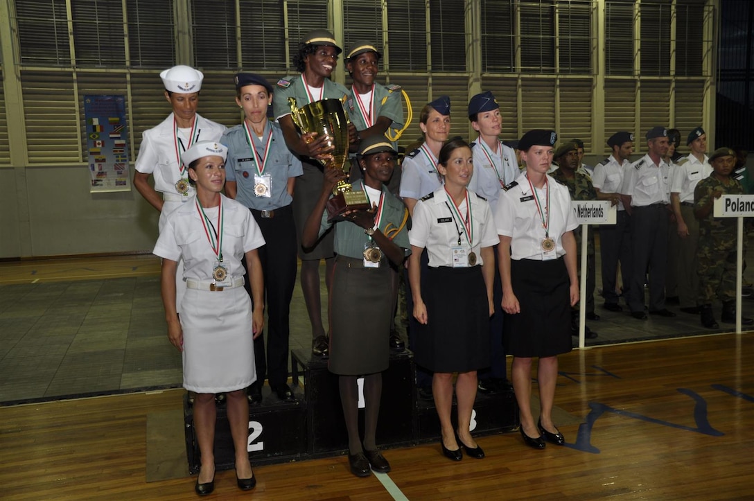 US Armed Forces women take the bronze behind Namibia and Brazil during the 2013 CISM World Military Marathon Championship in Paramaribo, Suriname on 23 November.  L-R: Top Lt Col Brenda Schrank (USAF); Maj Elissa Ballas; Bottom: CPT Nicole Solana (Army); CPT Samantha Wood (Army)