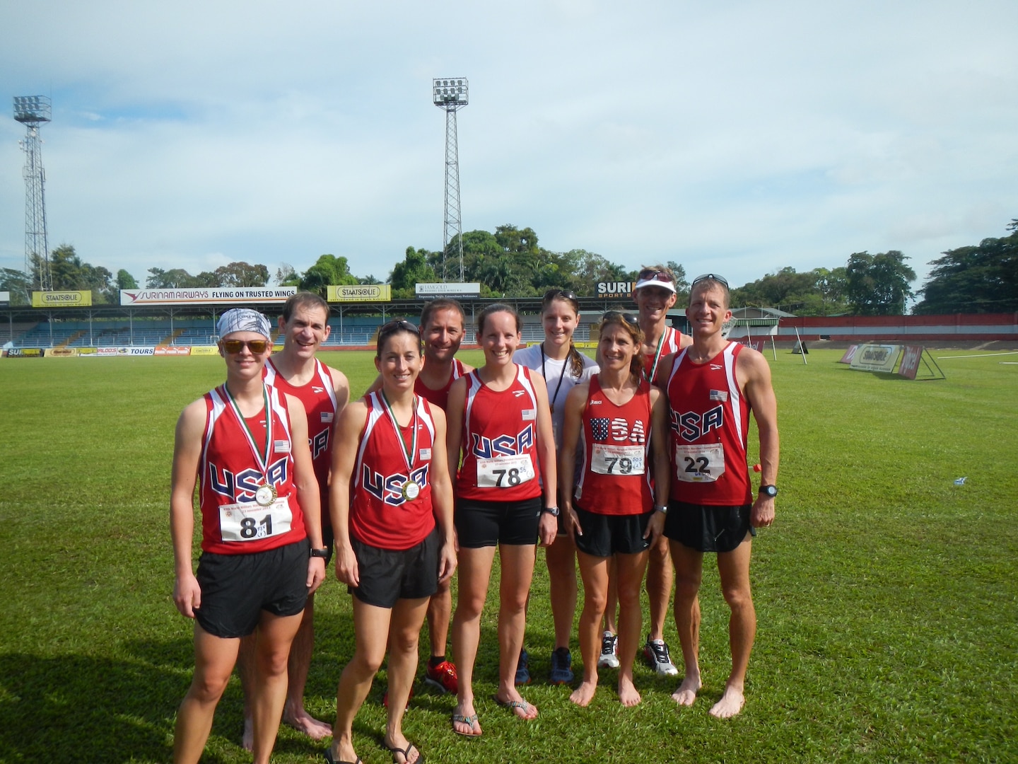 Team USA after their run during the 2013 CISM World Military Marathon Championship in Paramaribo, Suriname on 23 November.  From left to right: CPT Samantha Wood (Army); LTC Liam Collins (Army); CPT Nicole Solana (Army); CDR Matthew Thomas (Navy); Maj Elissa Ballas (USAF); Capt Justine Whipple (USMC); Lt Col Brenda Schrank (USAF); PO2 Justin Thurner (Navy); CDR Conrad Orloff (Navy)