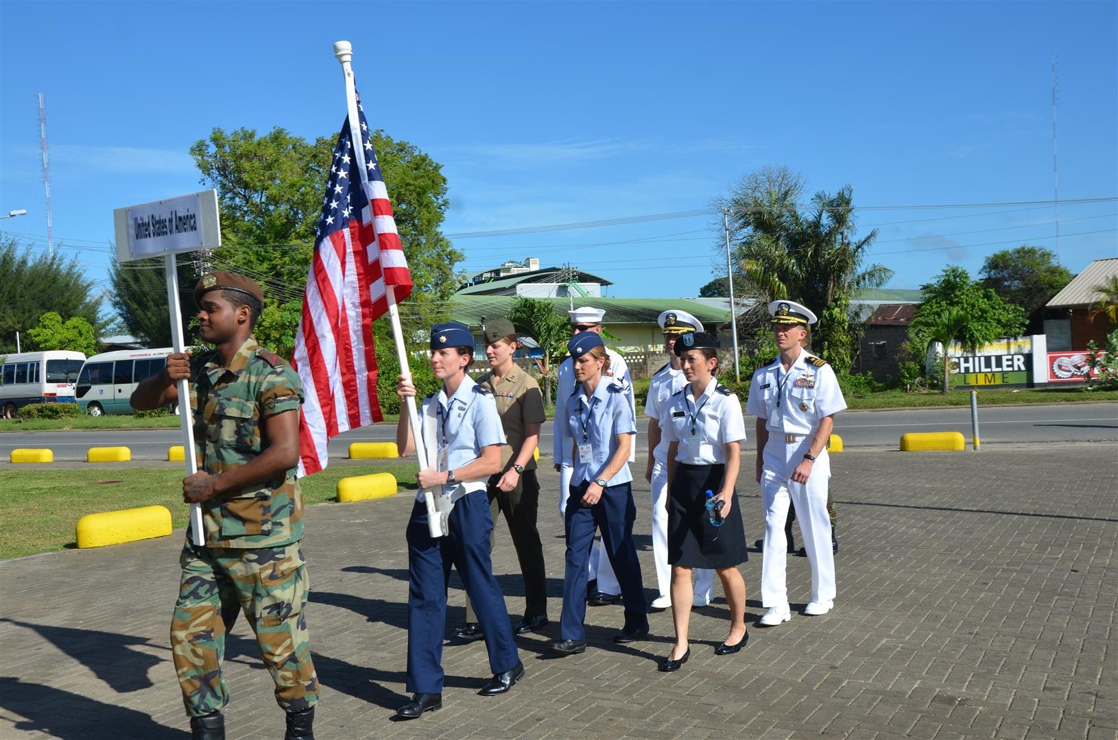 Maj Elissa Ballas carries the flag as Team USA marches in for the opening ceremony of the 2013 CISM World Military Marathon Championship in Paramaribo, Suriname on 19-24 November.