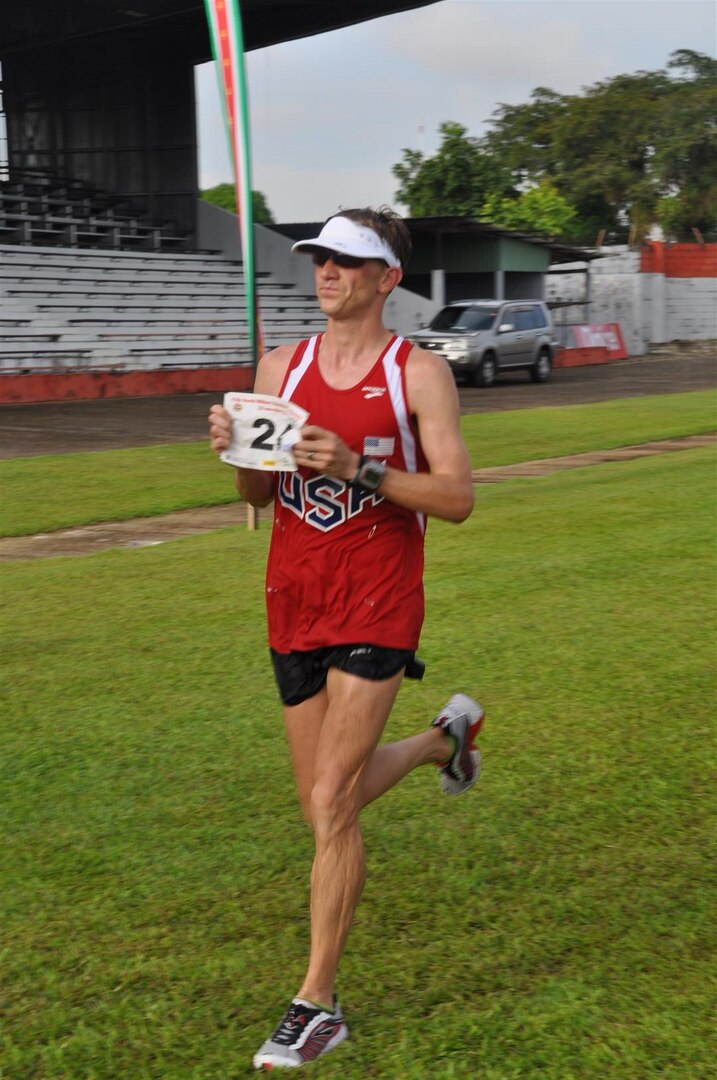 PO2 Justin Turner crosses the finish line with a time of 2.37.59 (19th overall) during the 2013 CISM World Military Marathon Championship in Paramaribo, Suriname on 23 November.