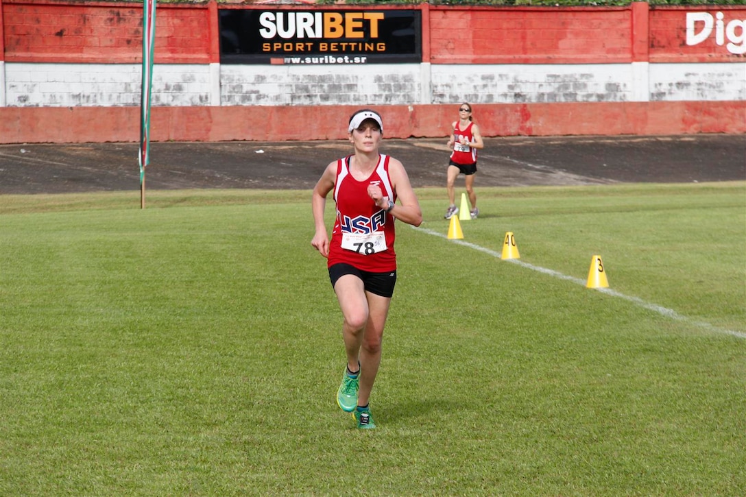 Maj Elissa Ballas (USAF) about to cross the finish line with a time of 3.08.50 (9th place) with Lt Col Brenda Schrank (USAF) – 3.09.02 (10th) right behind during the 2013 CISM World Military Marathon Championship in Paramaribo, Suriname on 23 November.