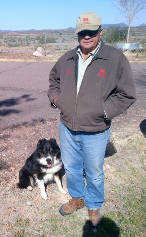 Having worked as a dam tender for more than 30 years, Donnie May (and his dog) is very familiar with the workings of Painted Rock Dam, upstream of Yuma, Ariz.  Since the dam is so isolated, the Corps of Engineers built two residences on site to allow the local tenders to live there.  