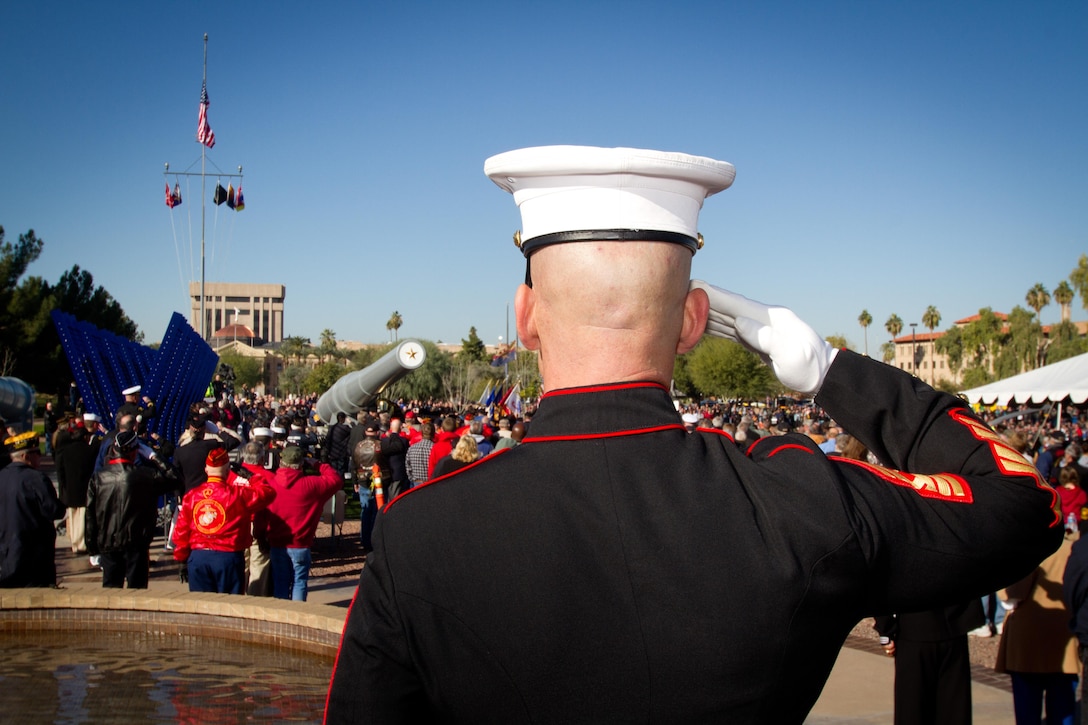 Sergeant Major Jerry Gomes, sergeant major of Marine Corps Recruiting Station Phoenix, renders a salute after placing a wreath at the base of the anchor of U.S. Battleship USS Arizona during the dedication ceremony of a World War II memorial in Phoenix, Dec. 7, 2013. “It is an honor to be the bearer of a wreath honoring our greatest generation and the many Marines and service members who laid the foundation for this country,” said Gomes. The memorial features the names of the military personnel from Arizona who died during the war displayed on steel plates between massive gun barrels from the USS Arizona and USS Missouri.