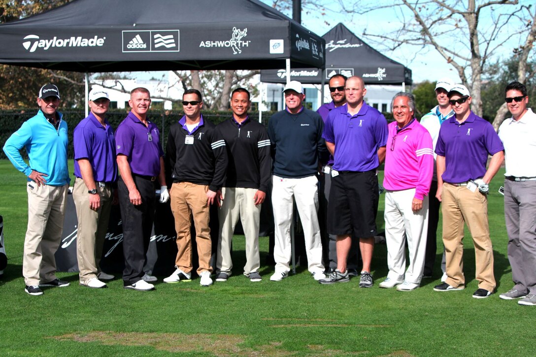 Members of Operation Game On pose for a group photo at Taylormade the Kingdom, a driving range with professional fitters, in Carlsbad, Calif., Nov. 26, 2013. The group is the first group from Wounded Warrior Battalion West to participate in Operation Game On.