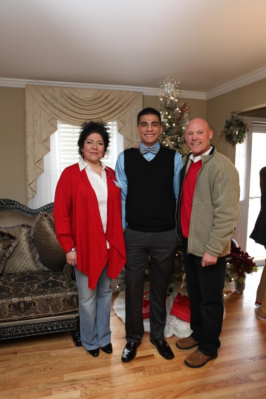 Sgt. Maj. Micheal P. Barrett, the 17th Sergeant Major of the Marine Corps, host a holiday reception at his home in Arlington, Va., on Dec. 7, 2013. (U.S. Marine Corps photo by Sgt. Marionne T. Mangrum)