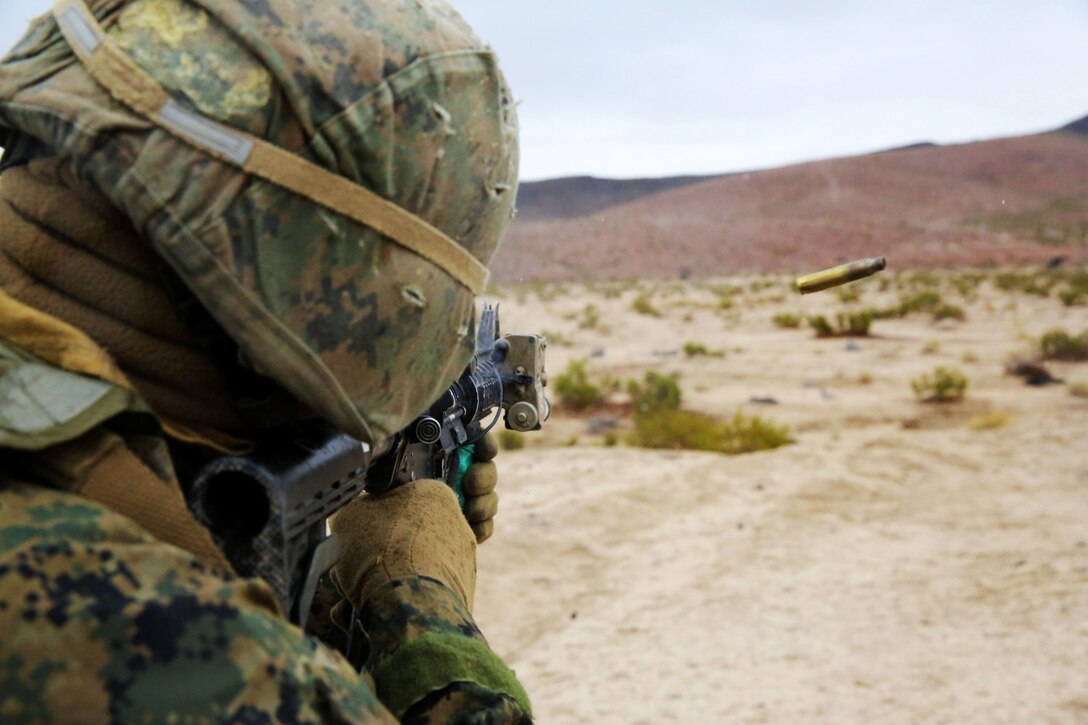 ARMY NATIONAL TRAINING CENTER FORT IRWIN, Calif. - A Marine with Delta Company, 1st Light Armored Reconnaissance Battalion, fires his weapon at an unknown distance target during a weeklong field exercise here, during Nov. 18 to Nov. 24, 2013. The targets ranged from 150 meters to 400 meters away. The Marines had to hit 80 percent of the targets to qualify and move on to more complex training. The Marines conducted a 175 mile road march from their home at Camp Pendleton to Fort Irwin to use the Army base’s training facilities.