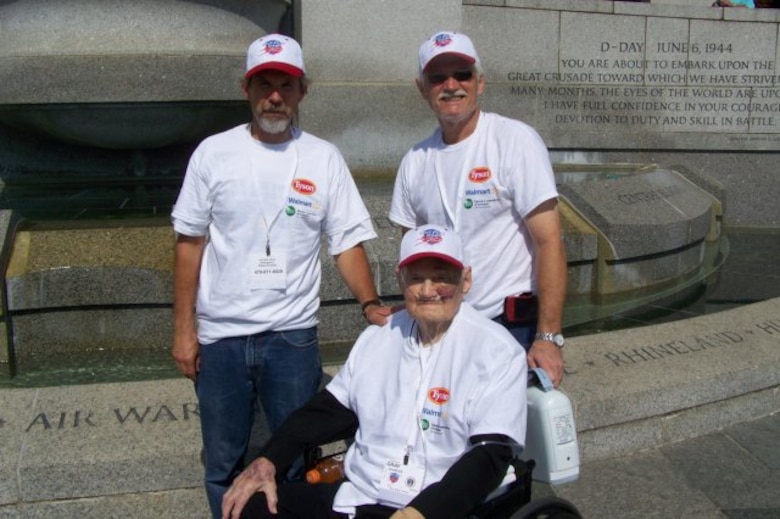 Bill Gray (left), Charles Gray (center) and Tommy Gray (right) at the World War II Memorial.