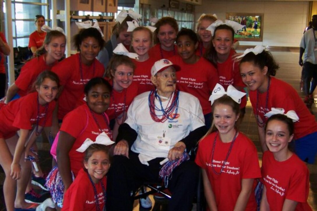 Volunteers welcome Charles Gray in Washington, D.C., as part of the Honor Flight.