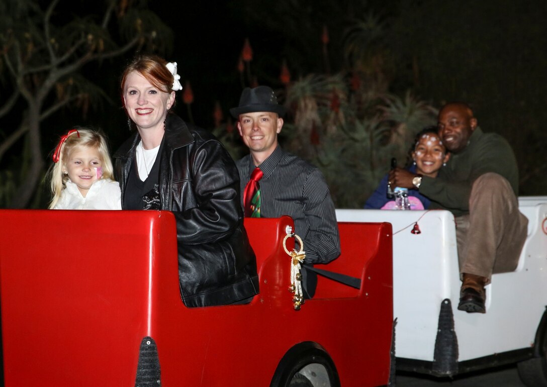 Marines and families of the 15th Marine Expeditionary Unit ride on a train during the unit’s holiday party at the San Diego Botanical Gardens in Encinitas, Calif., Dec. 6. During the party, families enjoyed food, Santa and an ugly sweater contest. (U.S. Marine Corps photo by Cpl. Emmanuel Ramos)