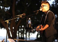 Singer and ukulele sensation Aidan James performs during the 44th Annual Tower Lighting Celebration at Joint Base Pearl Harbor-Hickam, Hawaii, Dec. 6, 2013. The celebration included food and entertainment for all ages, including a visit from Santa, arts and crafts, and live band performances from the Hana Hou! Rock Band from the Air Force Band of the Pacific and James. The highlight of the event was the lighting of Freedom by actors Emma Stone and Bill Murray. (U.S. Air Force photo/Staff Sgt. Alex Martinez)
