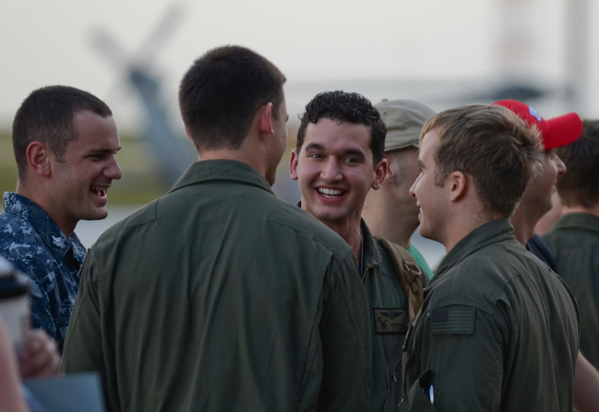 Friends welcome members of U.S. Navy Helicopter Sea Combat Squadron 25 Detachment 6 during the HSC-25 Det. 6 homecoming Dec. 9, 2013, on Andersen Air Force Base, Guam. During the unit’s nine-month deployment aboard USS Bonhomme Richard, Det. 6 supported the U.S. Navy 7th Fleet in the Western Pacific area of responsibility. (U.S. Air Force photo by Senior Airman Marianique Santos/Released)