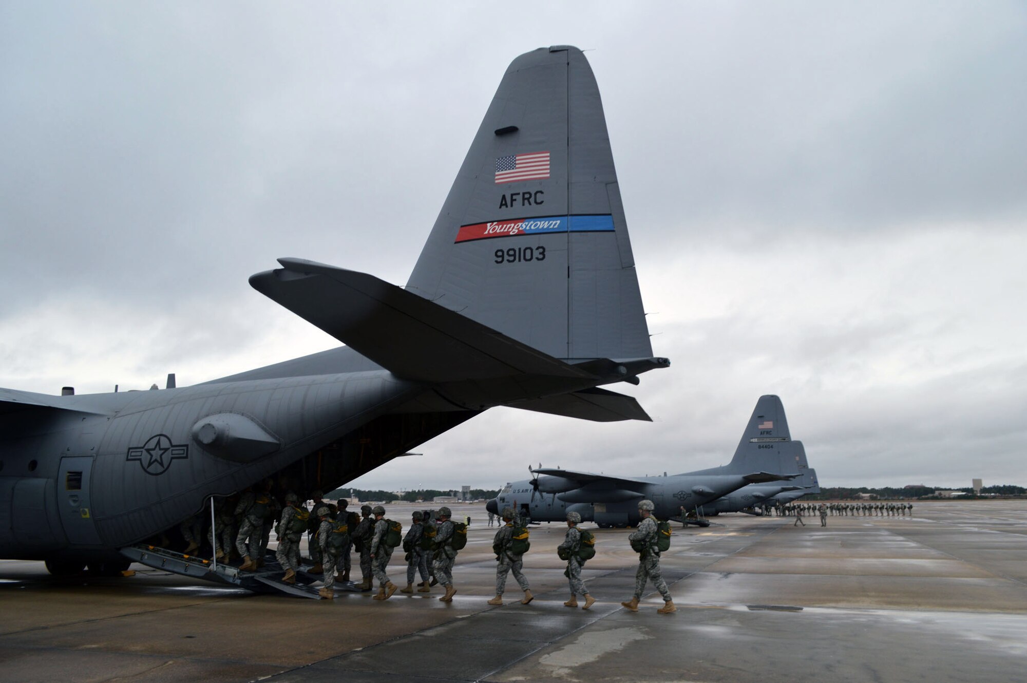U.S. Army paratroopers from Fort Bragg, N.C. load onto a C-130H Hercules aircraft from the 910th Airlift Wing, Youngstown, Ohio, on Green Ramp during Operation Toy Drop 2013, Pope Army Airfield, N.C. on Dec. 7. Operation Toy Drop is an annual U.S. Army Civil Affairs and Psychological Operations Command (Airborne) sponsored event. The main purpose is to gather toys donated by Fort Bragg Soldiers and distribute them to local children who might otherwise not receive a toy for the holidays. A large airborne operation is also part of Operation Toy Drop. Paratroopers will get a chance to train with a jumpmaster from one of nine countries participating this year. This allows them to earn foreign airborne or “jump” wings. (U.S. Air Force photo/Marvin Krause) 