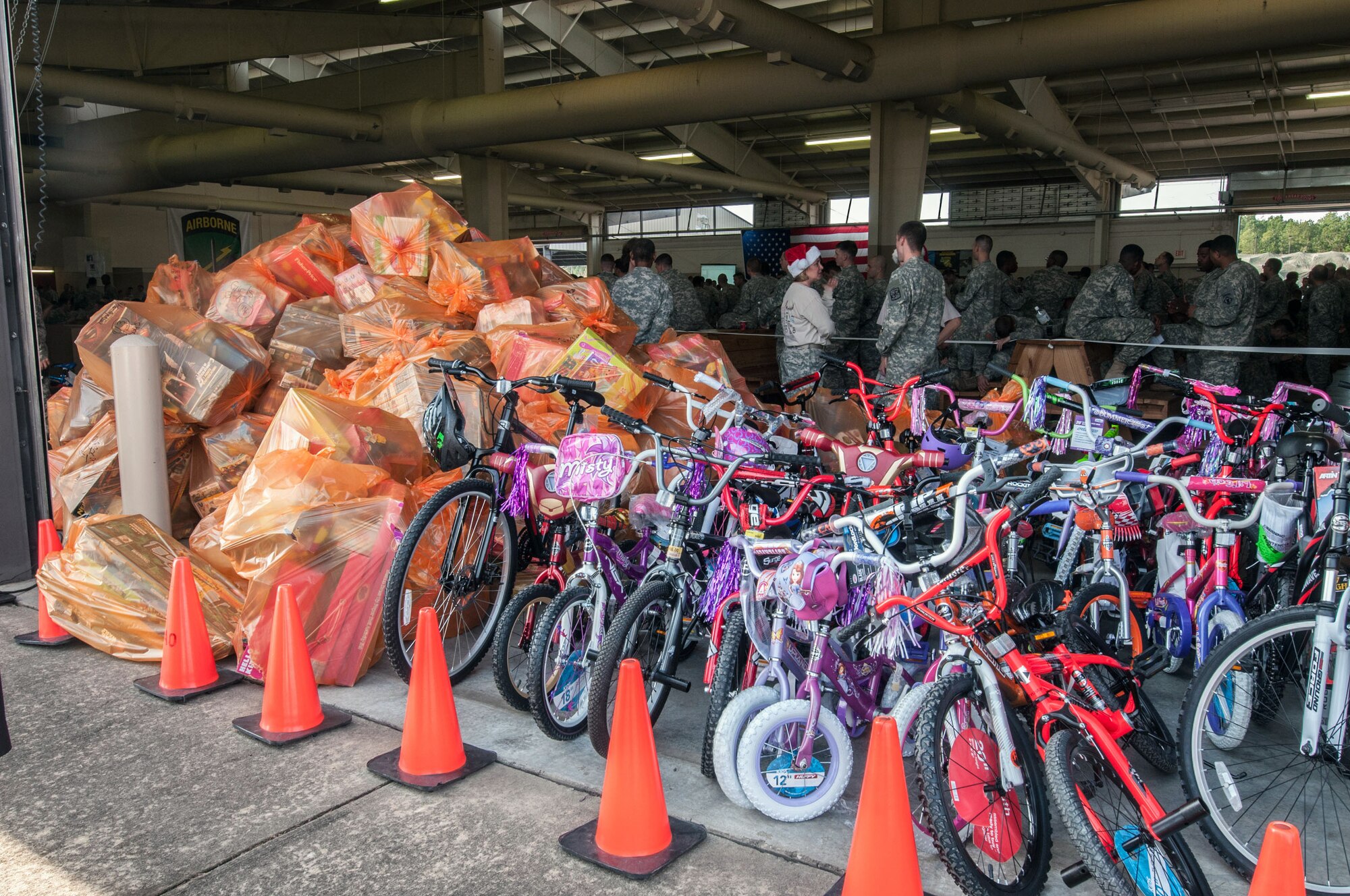 Thousands of donated toys wait to be moved to a temporary storage area during the 16th Annual Randy Oler Memorial Operation Toy Drop, at Green Ramp, Pope Army Airfield, Fort Bragg, N.C., Dec. 6, 2013. The first phase of toy drop includes bringing in an unwrapped toy to receive a ticket. The tickets are then randomly drawn to earn the seat for tomorrow's airborne operation at Sicily Drop Zone. Last year, Operation Toy Drop collected more than 12,000 toys which were donated to charities and organizations across North Carolina. (U.S. Army photo/Timothy L. Hale)