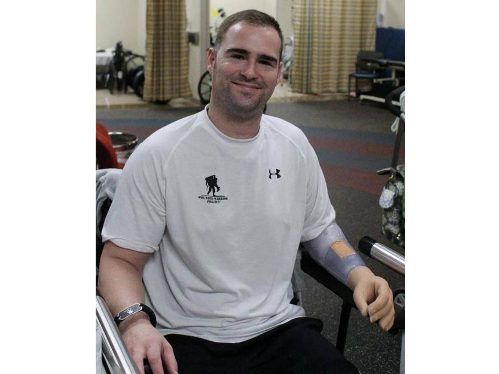Master Sgt. Joseph Deslauriers, Air Force Special Operations Command explosive ordnance device program manager, smiles with his new prosthetic arm.
(Photo courtesy of Building Homes for Heroes) 