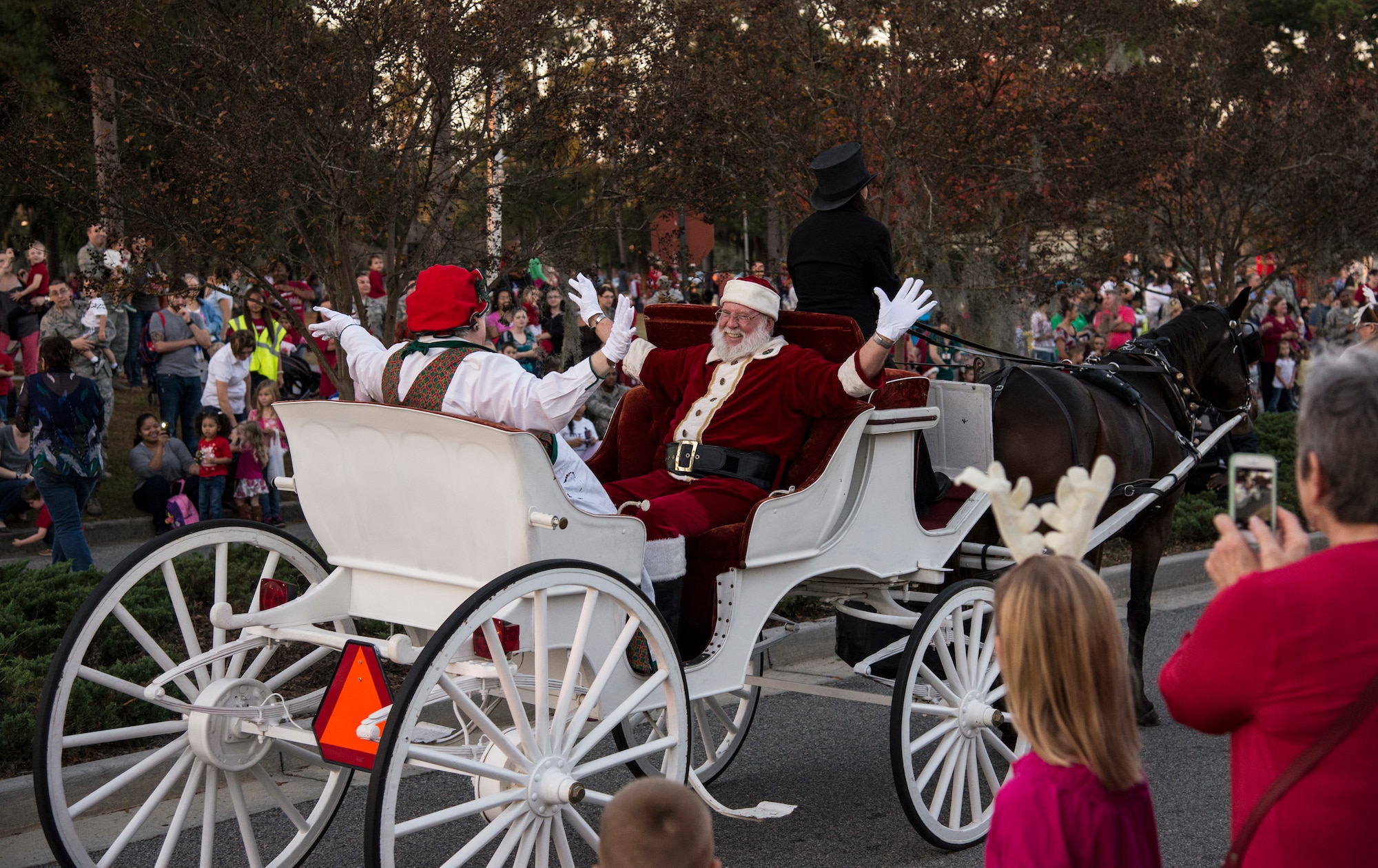 Mr. and Mrs. Claus make an appearance at the Annual Tree Lighting Ceremony and Holiday Parade Dec. 6, 2013, at Moody Air Force Base, Ga. After the ceremony, children got the chance to meet and take photos with the two. (U.S. Air Force photo by Airman 1st Class Sandra Marrero/Released) 
