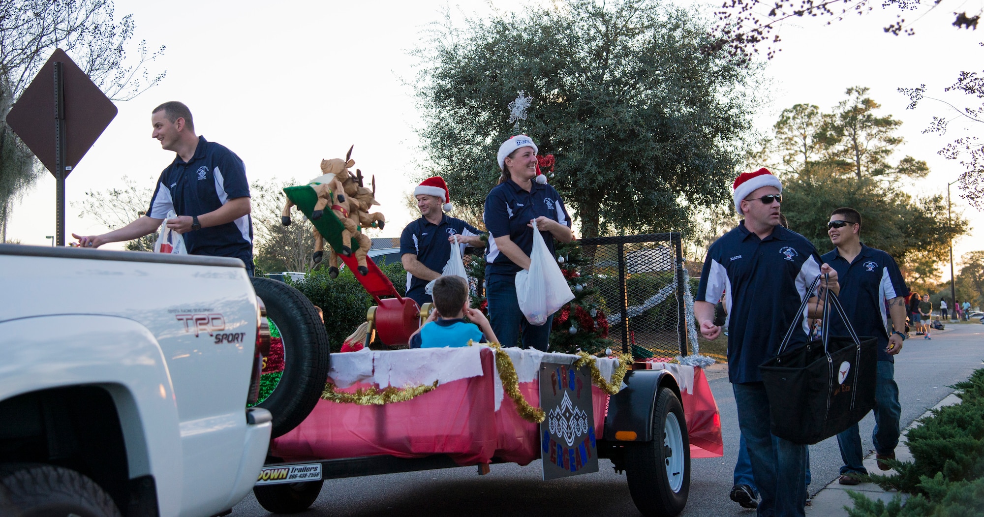 The First Sergeants Association takes part in the Annual Tree Lighting Ceremony and Holiday Parade at Moody Air Force Base, Ga., Dec. 6, 2013. The tree lighting ceremony also included caroling by Youth Programs and an artificial snow pit. (U.S. Air Force photo by Airman 1st Class Sandra Marrero/Released) 

