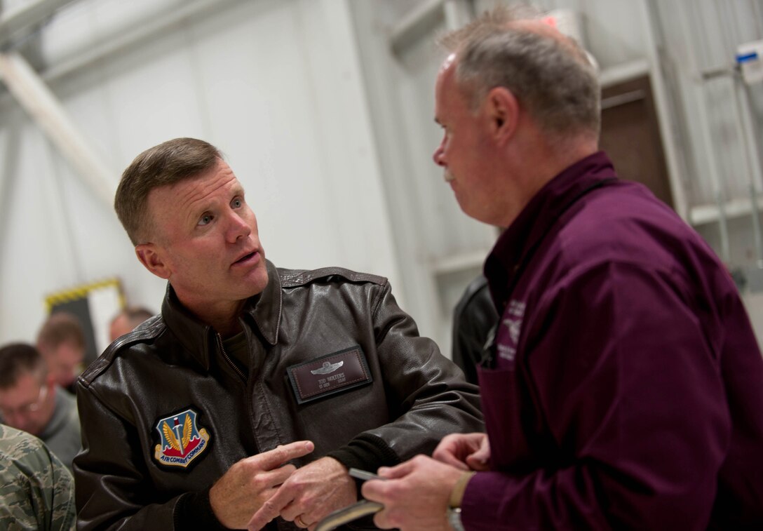 Lt. Gen. Tod D. Wolters, 12th Air Force (Air Forces Southern) commander, talks with Brian James, 28th Maintenance Group Air Force Engineering and Technical Services chief, about his role in accomplishing the base mission during a visit at Ellsworth Air Force Base, S.D., Dec. 4, 2013. Wolters emphasized to all Airmen he met that their efforts are greatly appreciated and recognized by not only Ellsworth leaders, but top Air Force leaders as well. (U.S. Air Force photo by Senior Airman Zachary Hada/Released)