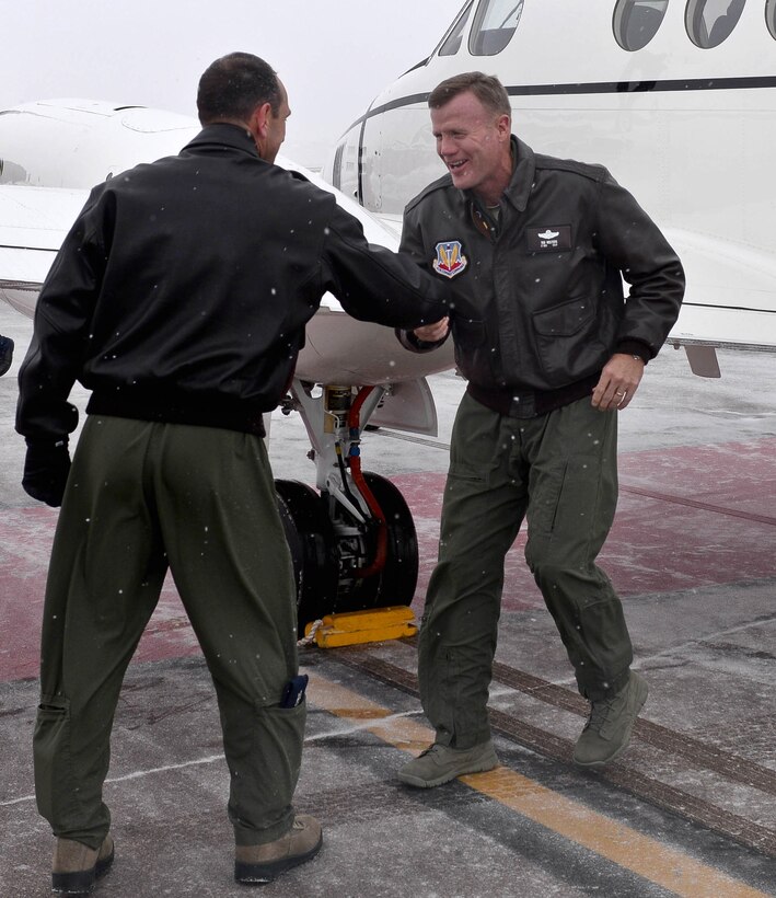 Col. Kevin Kennedy, 28th Bomb Wing commander, welcomes Lt. Gen. Tod D. Wolters, 12th Air Force (Air Forces Southern) commander, as he arrives at Ellsworth Air Force Base, S.D., Dec. 3, 2013. Wolters and Chief Master Sgt. Calvin Williams, 12th Air Force (Air Forces Southern) command chief, visited Ellsworth Dec. 3 and 4 and to discuss current issues and challenges the Air Force is facing with Ellsworth Airmen and to thank them for their dedicated service. (U.S. Air Force photo by Senior Airman Zachary Hada/Released)