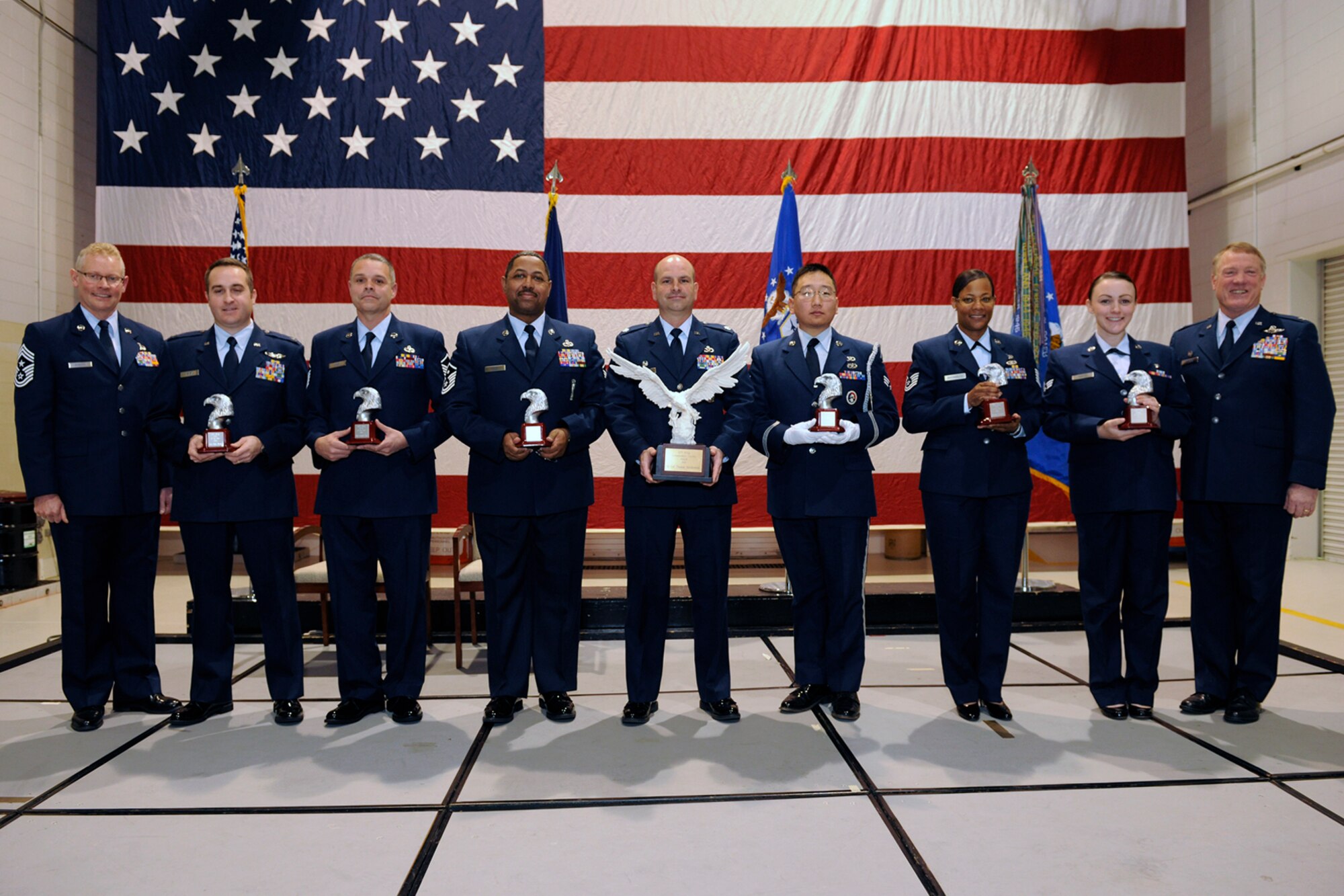 131208-Z- EZ686-083 – The winners of the 127th Wing’s Airmen of the Year Awards stand with their awards following the 127th Wing Commander’s Call ceremony at Selfridge Air National Guard Base, Mich., Dec. 8, 2013. Pictured are, from left, Chief Master Sgt. Robert Dobson, 127th Wing command chief; Capt. Bryan Amara, company grade officer of the year; Master Sgt. Christopher Tear, senior noncommissioned officer of the year; Master Sgt. Harold Hayes, first sergeant of the year; Lt. Col. Thomas Sierakowski, commander’s trophy; Senior Airman Eric Kim, Honor Guard member of the year; Technical Sgt. Mary Buchholtz, noncommissioned officer of the year; Senior Airman Kylee Coats, Airman of the year; and Col. Michael Thomas, 127th Wing commander. (U.S. Air National Guard photo by MSgt. David Kujawa / Released)