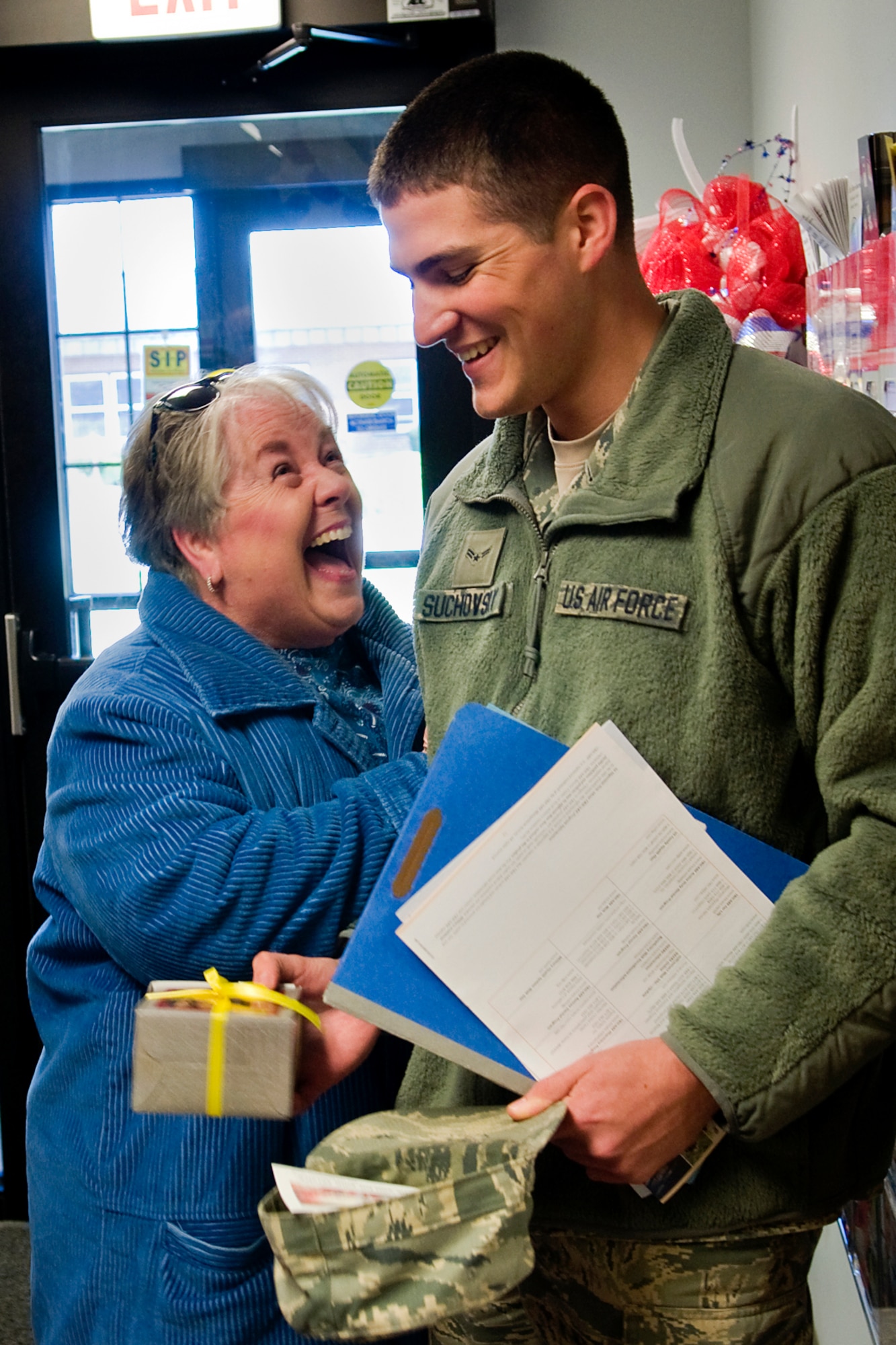 Judy Friend welcomes home Airman 1st Class Jordan Suchovsky, 434th Operations Support Squadron aviation resource management specialist, from a deployment to Southwest Asia in the Airman and Family Readiness Center at Grissom Air Reserve Base, Ind., Nov. 18, 2013. Friend and two other community members came to the north-central Indiana base to welcome home Airmen and thank them for their service. (U.S. Air Force photo/Tech. Sgt. Mark R. W. Orders-Woempner)
