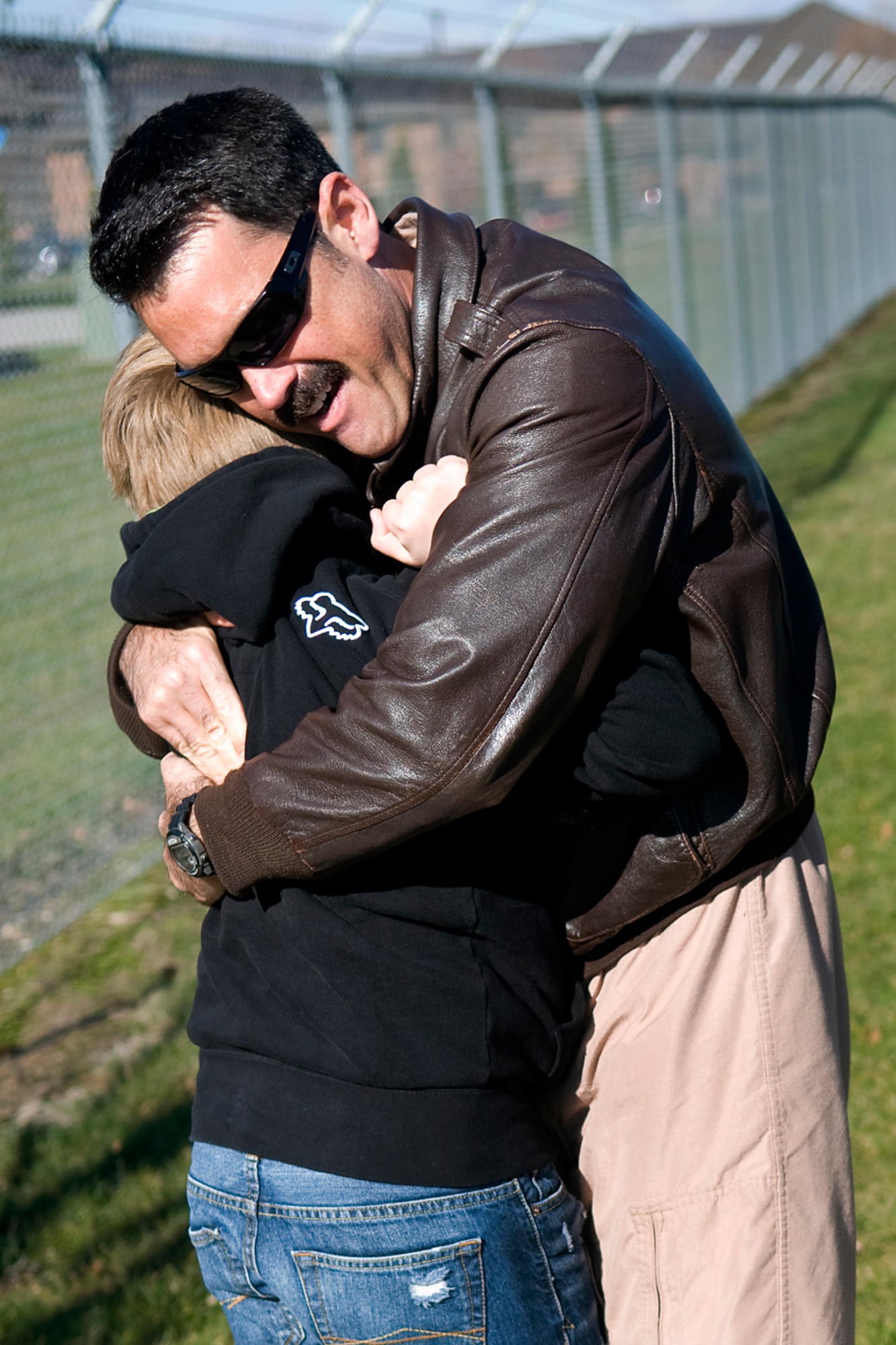 Lt. Col. Erik Aufderheide, 72nd Air Refueling Squadron commander, embraces his 10-year-old son, Leif, after returning to Grissom Air Reserve Base, Ind., from a deployment to Southwest Asia Nov. 18, 2013. Aufderheide returned with nearly 40 other Grissom Airmen just in time for the holidays. (U.S. Air Force photo/Tech. Sgt. Mark R. W. Orders-Woempner)
