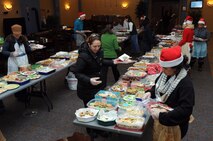 Volunteers bag cookies donated to the Grand Forks Air Force Base Spouses Club Annual Holiday Cookie Drive, Dec. 9, 2013, on Grand Forks AFB, N.D. More than 400 dozen cookies were donated and delivered to Airmen living in base dormitories. (U.S. Air Force photo/Staff Sgt. David Dobrydney)