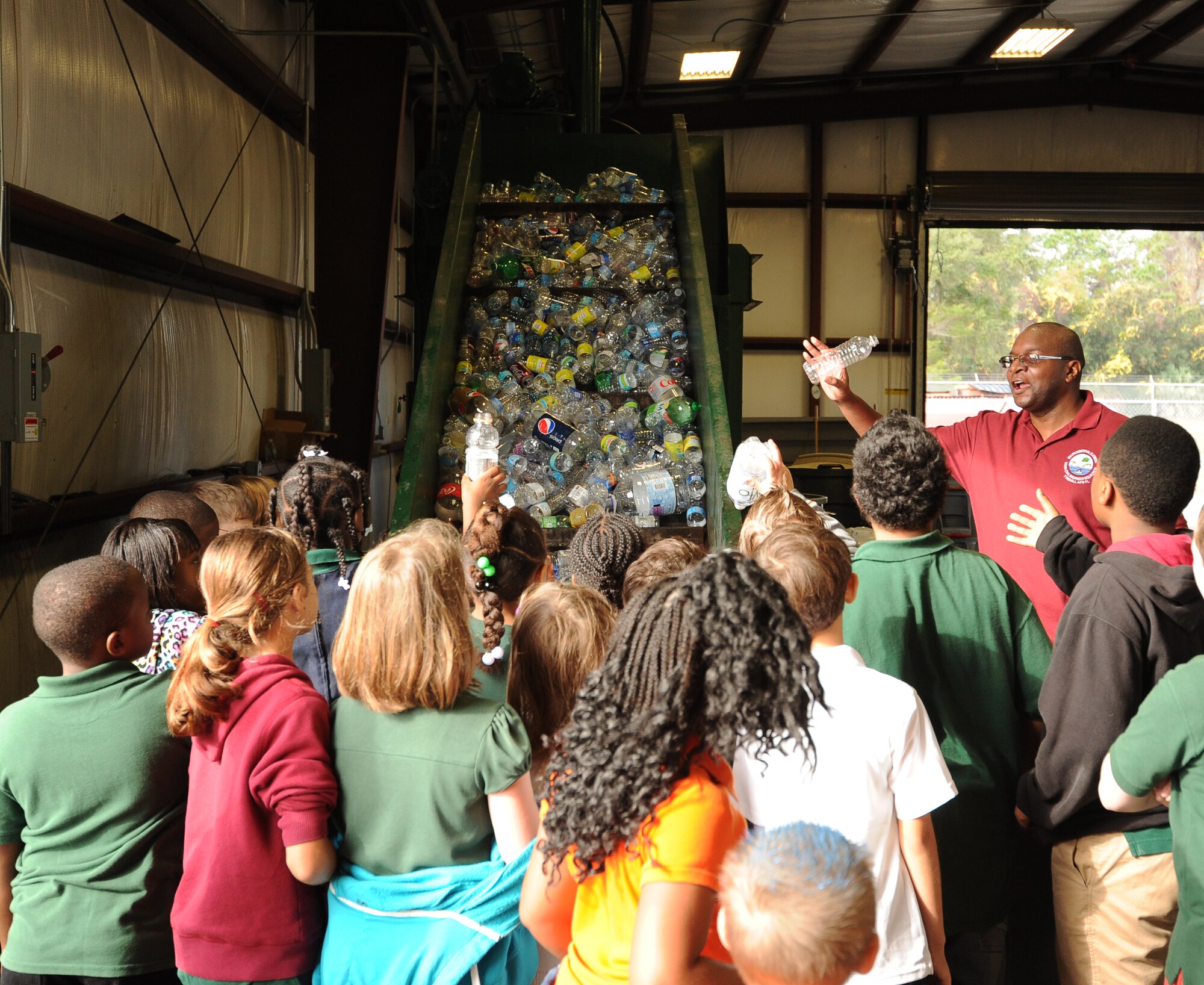 Students from Springfield Elementary School learn where recycled items go during a visit to Tyndall Dec. 5 at the Recycling Center on base. This was part of a 325th Civil Engineer Squadron program that teaches environmental information to local schools. (U.S. Air Force photo by Airman 1st Class Alex Echols)