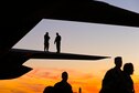 U.S. Air Force Master Sgt. Robin Wright, top left, a crew chief with the 440th Aircraft Maintenance Squadron and Tech. Sgt. Flint Hamilton a flight engineer with the 95th Airlift Squadron, Pope Field, N.C., perform a visual inspection on the wing of a C-130 Hercules cargo plane, as Airmen deplane at Pittsburg International Airport Air Reserve Station, Coraopolis, Pa., July 29, 2013. These Airmen are participating in Warrior Exercise 86-13-01 (WAREX)/Exercise Global Medic, 2013. The WAREX provides units an opportunity to rehearse military maneuvers and tactics. Held in conjunction with WAREX, Global Medic is an annual joint-field training exercise designed to replicate all aspects of theater combat medical support. (U.S. Air Force photo/Tech. Sgt. Efren Lopez)