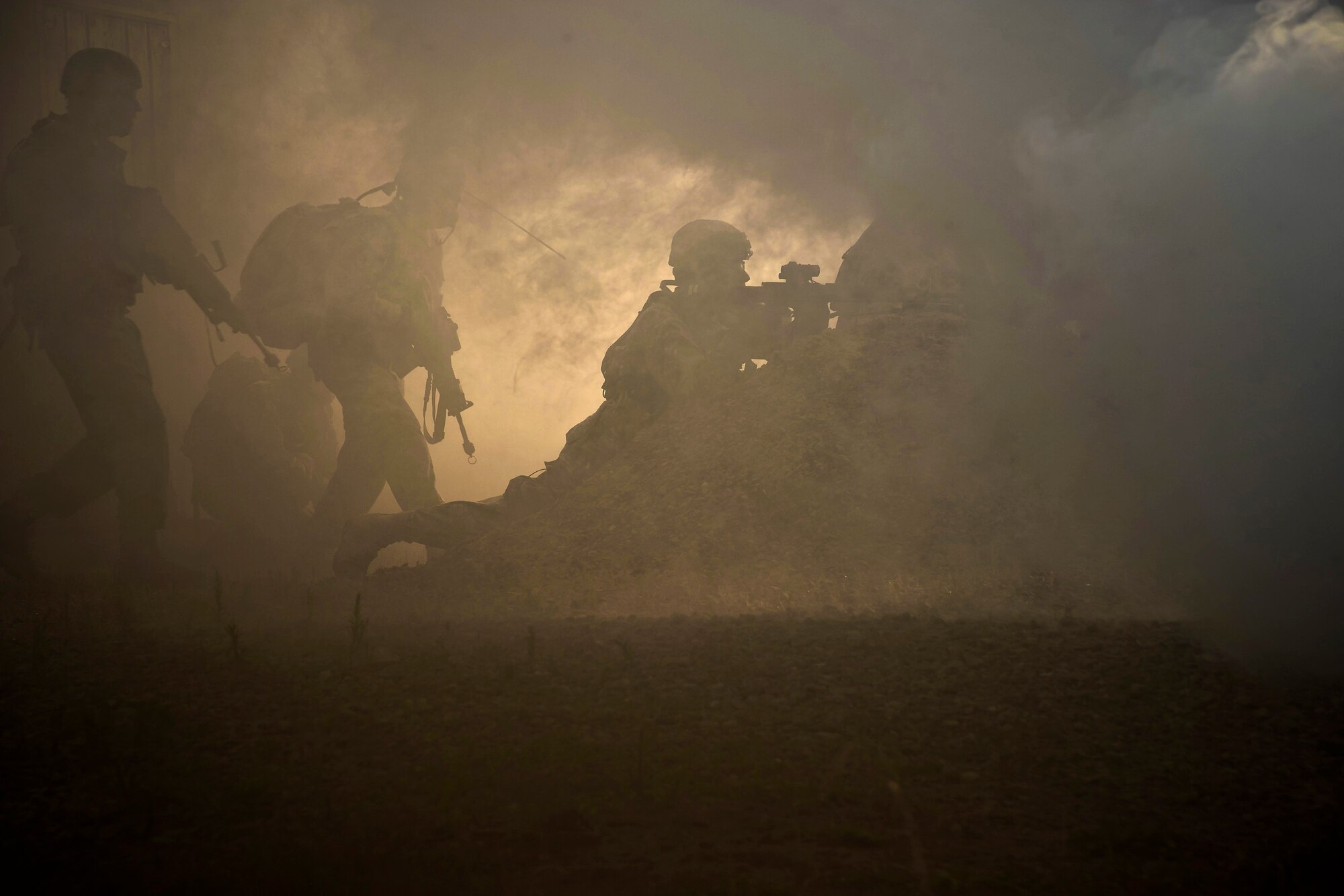 U.S. Soldiers from the 374th Combat Engineer Company, Vallejo, Calif., and the 1982 Forward Surgical Team, Niagara Falls, N.Y., conduct presence patrol training under the cover of M83 smoke in support of Warrior Exercise 86-13-01 (WAREX)/Exercise Global Medic, Fort McCoy, Wis., July 22, 2013. The WAREX provides units an opportunity to rehearse military maneuvers and tactics such as security, convoy operations, and quick reaction drills. Held in conjunction with WAREX, Global Medic is an annual joint-field training exercise designed to replicate all aspects of theater combat medical support. (U.S. Air Force photo/Staff Sgt. Heather Cozad)