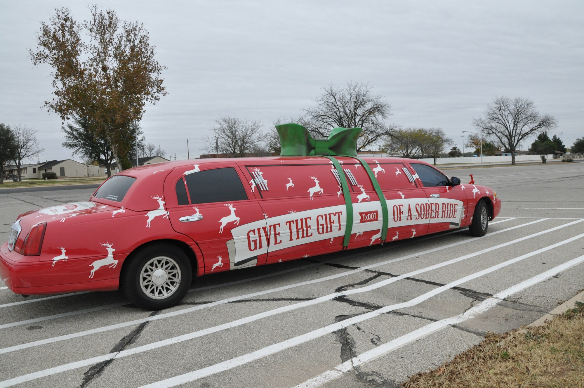 GOODFELLOW AIR FORCE BASE, Texas – The Sober Sleigh sits outside the Goodfellow theater Dec. 5. The Texas Department of Transportation brought their safety limo, the Sober Sleigh, to Goodfellow to promote their Holiday P.A.S.S. or Person Appointed to Stay Sober Campaign. (U.S. Air Force photo/ Airman 1st Class Breonna Veal)