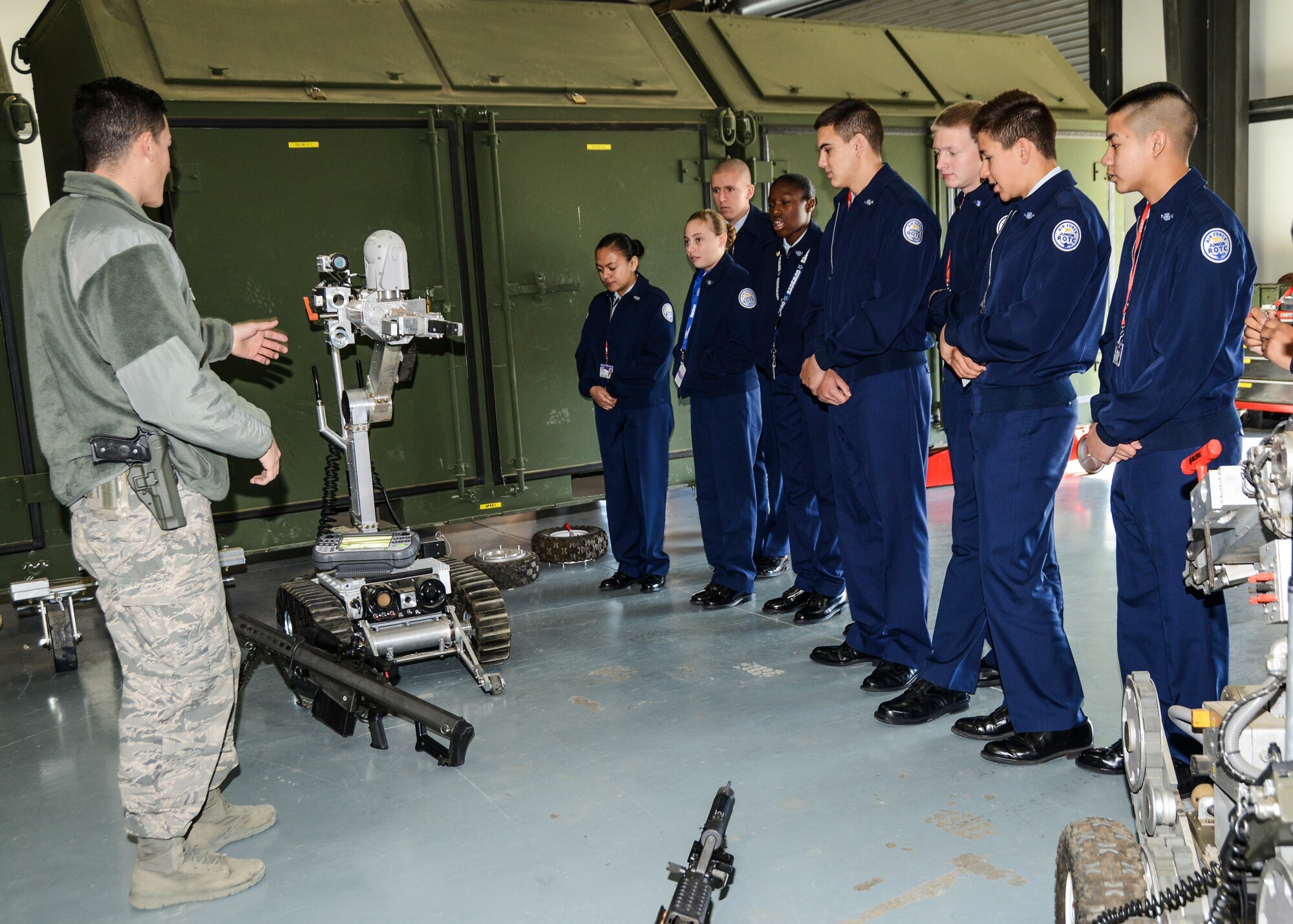 Senior Airman Kenneth Park, 412th Civil Engineering Directorate, Explosive Ordnance Disposal, explains the EOD’s robots and weapon systems to Junior ROTC cadets from Lancaster High School. (U.S. Air Force photo by Rebecca Amber)