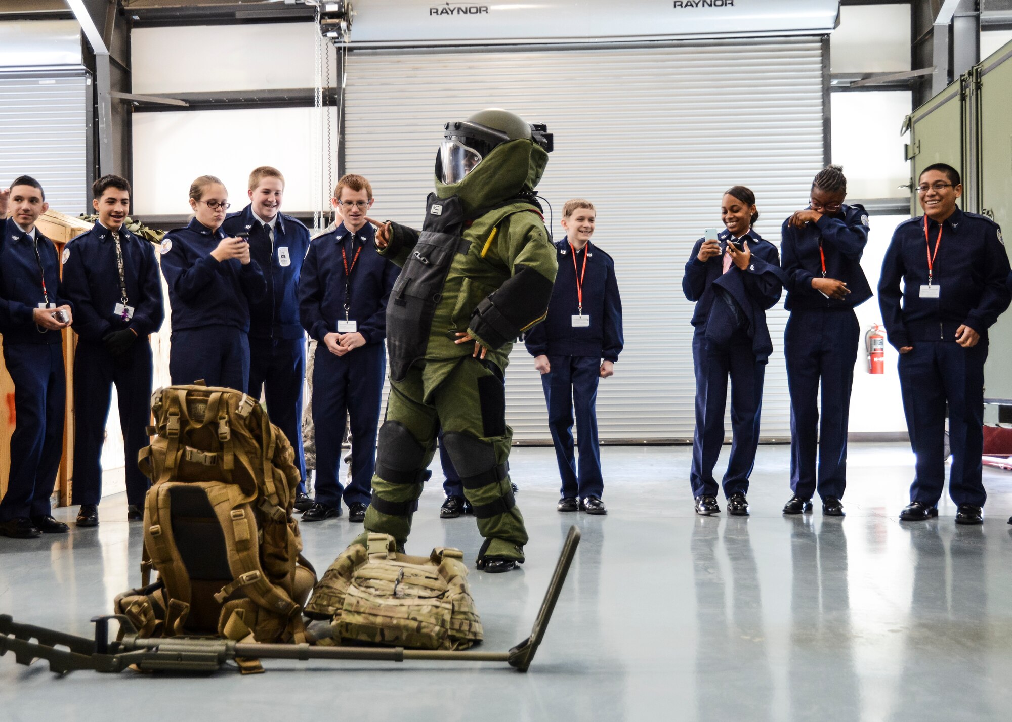 A Junior ROTC student from Lancaster High School volunteered to try on a bomb suit to experience the weight of the protective outerwear. The Junior ROTC cadets were being given a tour of Edwards AFB with one of the tour stops being the EOD compound. (U.S. Air Force photo by Rebecca Amber)