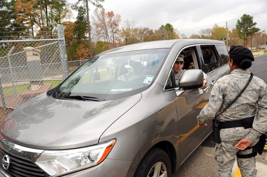 Col. Patrick Matthews, left, 2nd Mission Support Group commander, and Col. Andrew Gebara, 2nd Bomb Wing commander, cut the ribbon on the Bodcau Gate during an official opening ceremony on Barksdale Air Force Base, La., Dec. 2, 2013. After more than nine months of construction, the Bodcau Gate is officially open for traffic.  (U.S. Air Force photo/Staff Sgt. Katherine Holt)