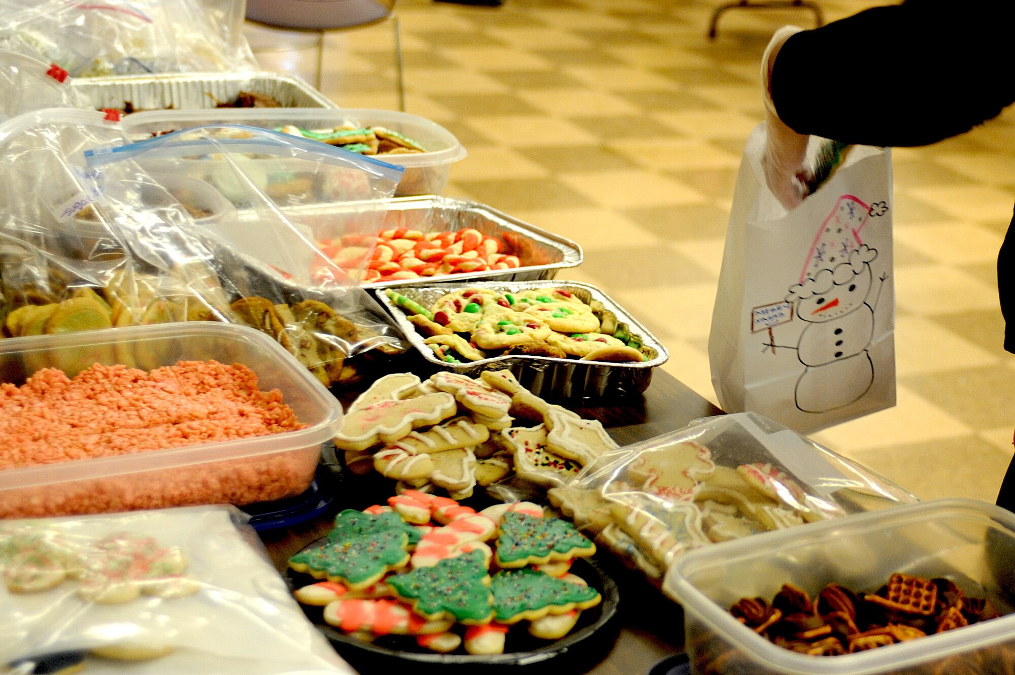 A goodie bag is loaded as part of Operation Cookie Drop Dec. 6, 2013, at Cannon Air Force Base, N.M. Operation Cookie Drop provides cookies to dormitory Airmen every year during the holiday season. (U.S. Air Force photo/Senior Airman Ericka Engblom)