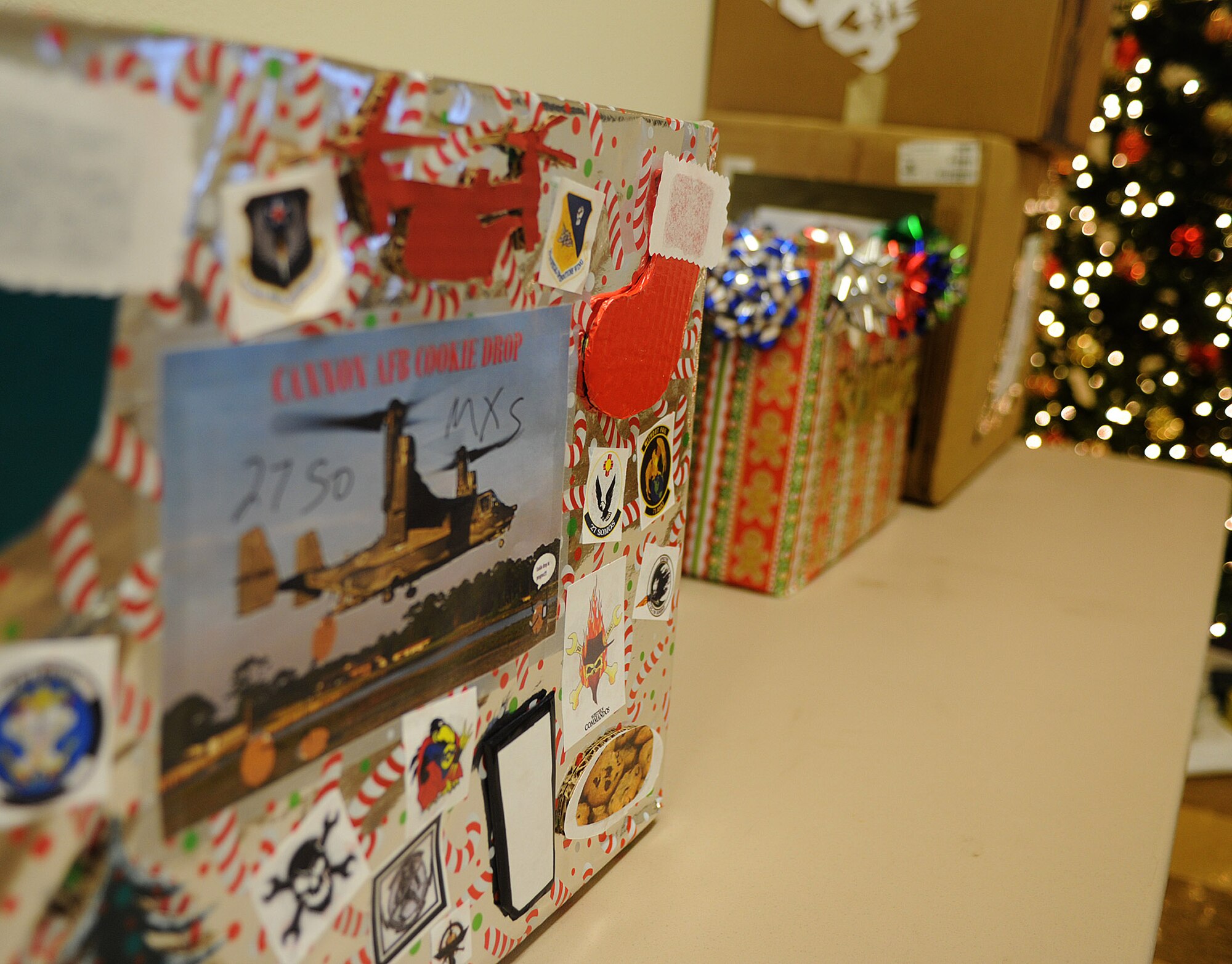 A cookie collection box sits on a table as part of Operation Cookie Drop Dec. 6, 2013, at Cannon Air Force Base, N.M. Operation Cookie Drop provides cookies to dormitory Airmen every year during the holiday season. (U.S. Air Force photo/Senior Airman Ericka Engblom)