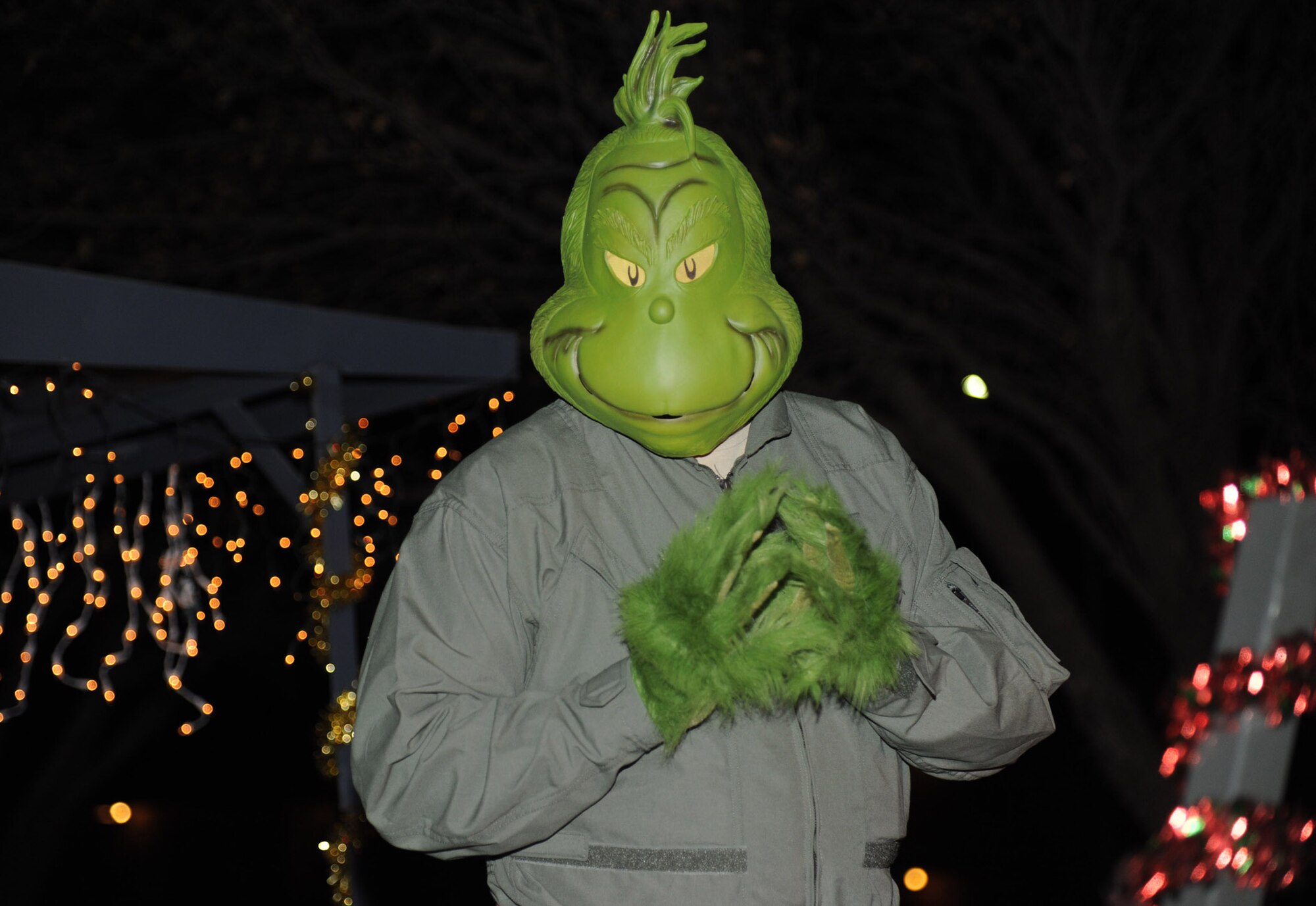 The Grinch who stole Christmas grins down from a float during the holiday parade Dec. 4, 2013, at Cannon Air Force Base, N.M. The parade included floats decorated by the squadrons and an appearance by Santa Claus himself. (U.S. Air Force photo/Airman 1st Class Chip Slack)