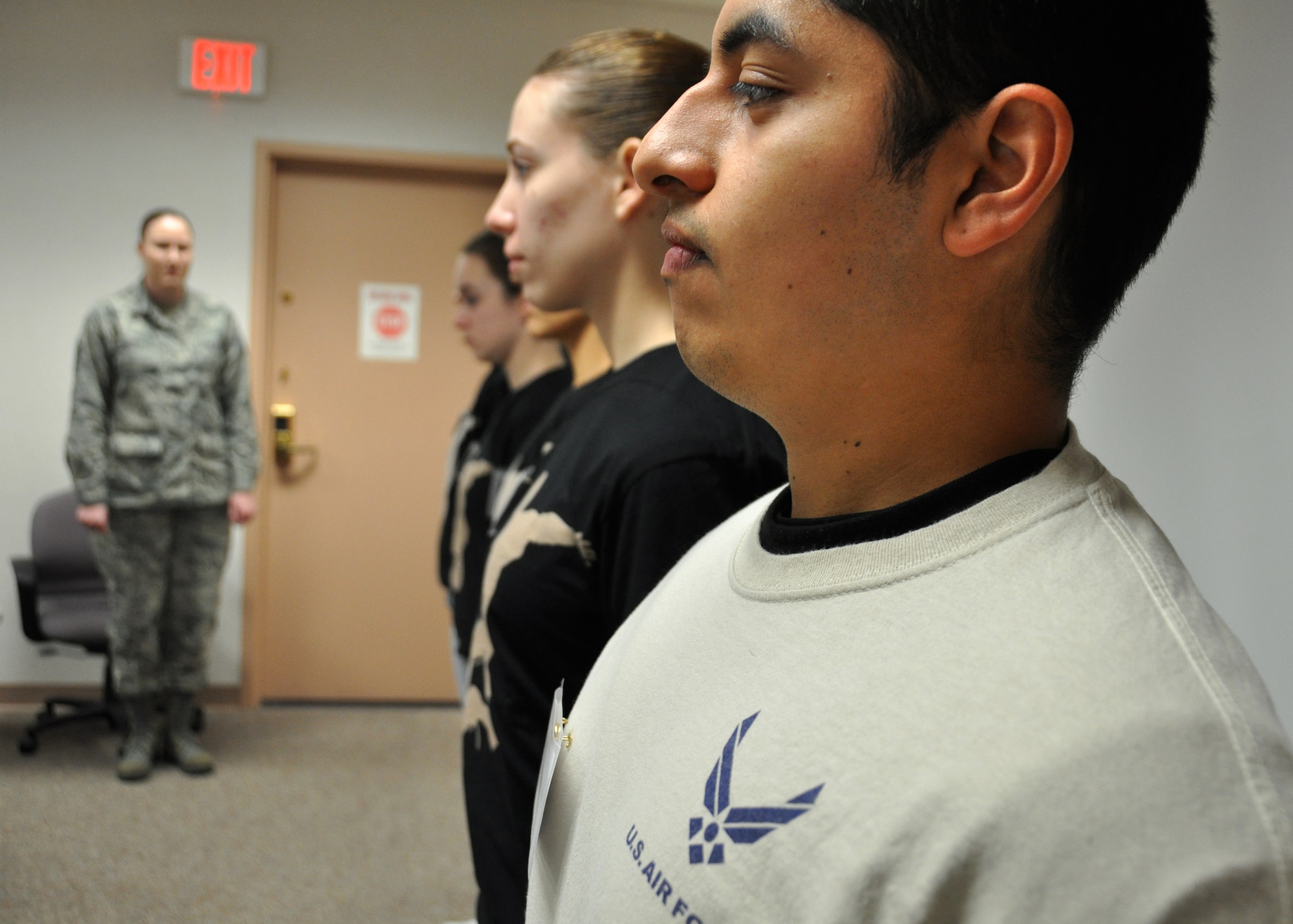 A group of Air Force Reserve trainees in the 940th Wing's first Development and Training Flight line up for inspection Dec 7, Beale Air Force Base, Calif. The flight chief set certain standards for the trainees and gave feedback during the inspection to help acclimate the trainees to a military lifestyle.  (U.S. Air Force photo/Tech Sgt Heather Skinkle)
