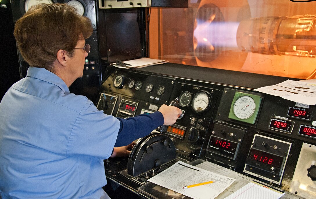 DynCorp International jet mechanic Maggie Bedford checks the functionality of a J85-5 engine from a T-38 aircraft on Dec. 4, 2013 at Sheppard Air Force Base, Texas. All aircraft engines are required to have a performance check before they are installed into an aircraft. (U.S. Air Force photo by Frank Carter/Released)