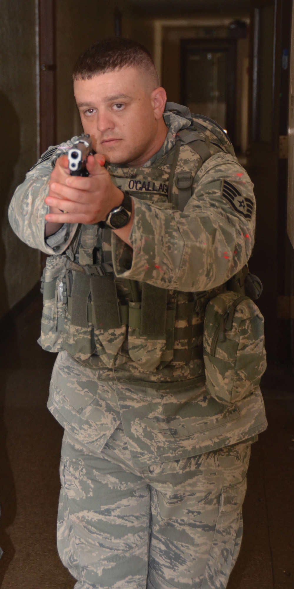 WRIGHT-PATTERSON AIR FORCE BASE, Ohio - Staff Sgt. Michael O’Callaghan, 445 SFS, searches for the “gunman.” Four 445th Security Forces Squadron reservists participated in a multi-agency Solo Engagement Training July 11 at the former Marine Corps Reserve training and administrative center located in Dayton, Ohio. The training was hosted by the Wright State University Police Department. (U.S. Air Force photo/Stacy Vaughn)