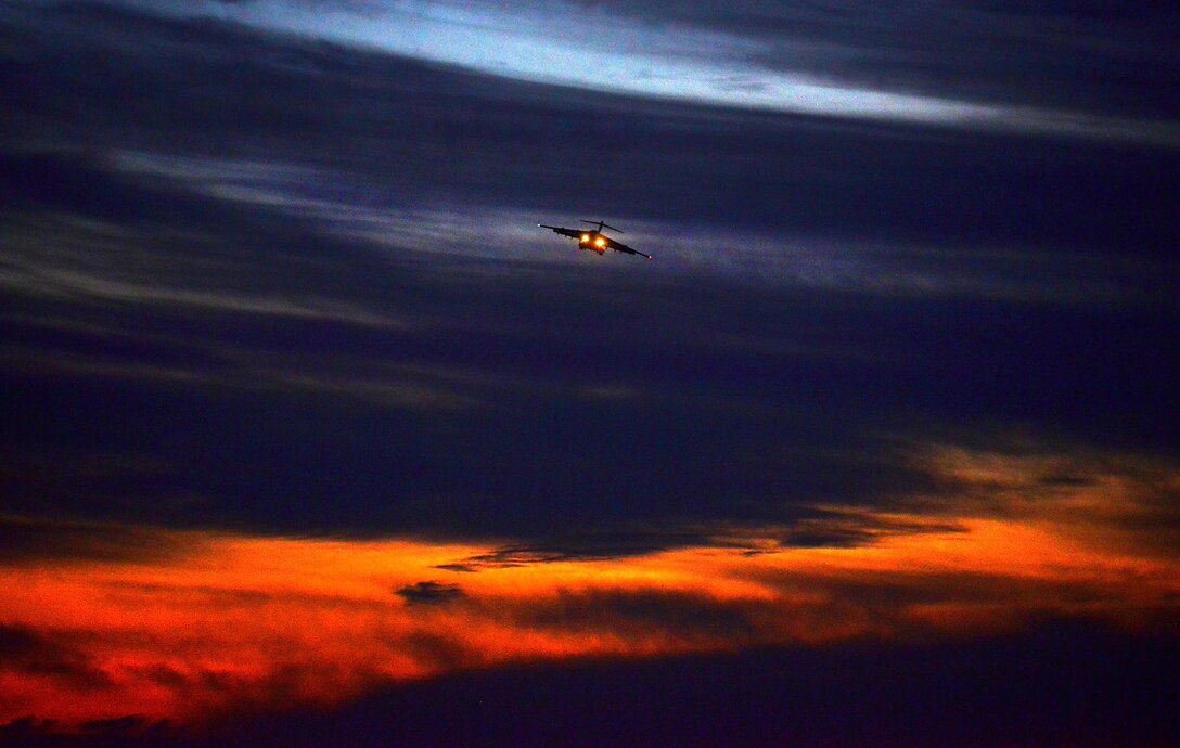 WRIGHT-PATTERSON AIR FORCE BASE, Ohio - The sunset across the Ohio valley provides the perfect backdrop for a 445th Airlift Wing C-17 Globemaster III flying a training mission over Fairborn, Ohio, Sept. 24. (U.S. Air Force photo/Tech. Sgt. Frank Oliver)