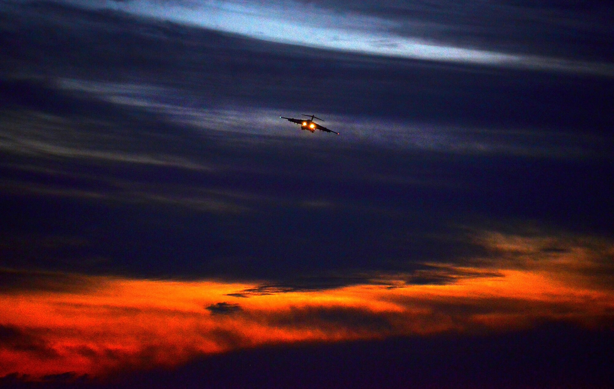 WRIGHT-PATTERSON AIR FORCE BASE, Ohio - The sunset across the Ohio valley provides the perfect backdrop for a 445th Airlift Wing C-17 Globemaster III flying a training mission over Fairborn, Ohio, Sept. 24. (U.S. Air Force photo/Tech. Sgt. Frank Oliver)