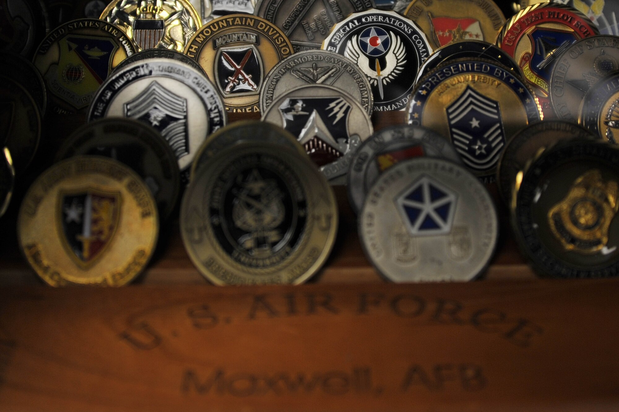 MAXWELL AIR FORCE BASE, Ala. – Dr. Bruce T. Murphy’s challenge coins sit in a wall display in his office at Air University Nov. 8, 2013. Murphy is the vice president of academic affairs at AU and is retiring Dec. 31, 2013. Murphy also has memorabilia from his time as a Soldier in the U.S. Army displayed in his office. (U.S. Air Force photo by Staff Sgt. Natasha Stannard)
