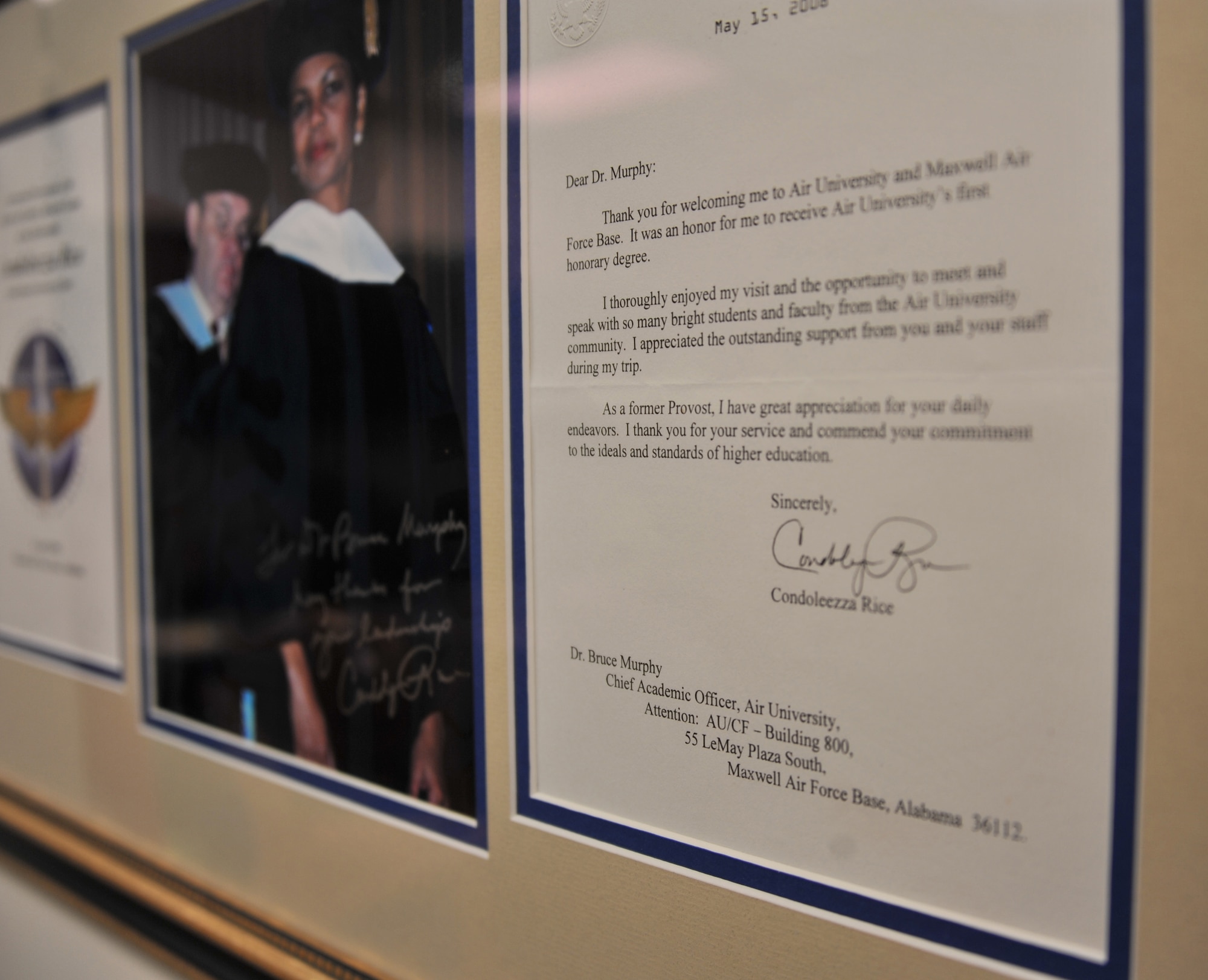 MAXWELL AIR FORCE BASE, Ala. – A photo of and letter from honorary graduate Condoleezza Rice hangs on Dr. Bruce T. Murphy’s wall Nov. 8, 2013. Murphy is Air University’s vice president of academic affairs and is retiring from the position Dec. 31, 2013. Facilitating the honorary degree program was one of his accomplishments as the VPAA. In the photo of Rice, Murphy is handing her the honorary degree. (U.S. Air Force photo by Staff Sgt. Natasha Stannard)
