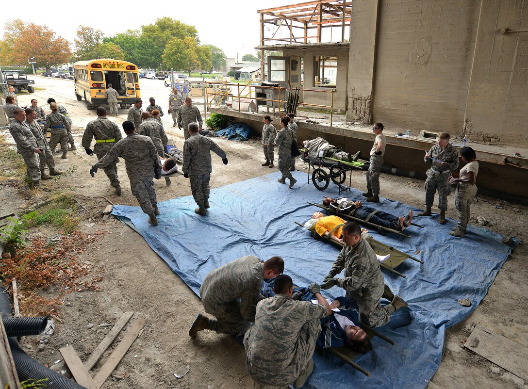 WRIGHT-PATTERSON AIR FORCE BASE, Ohio - Reservists from the 445th Aeromedical Staging Squadron form litter teams as they respond to a scenario during the wing’s massive disaster response exercise held at Calamityville training and research facility in Fairborn, Ohio, Sept. 29. (U.S. Air Force photo/Tech. Sgt. Frank Oliver)