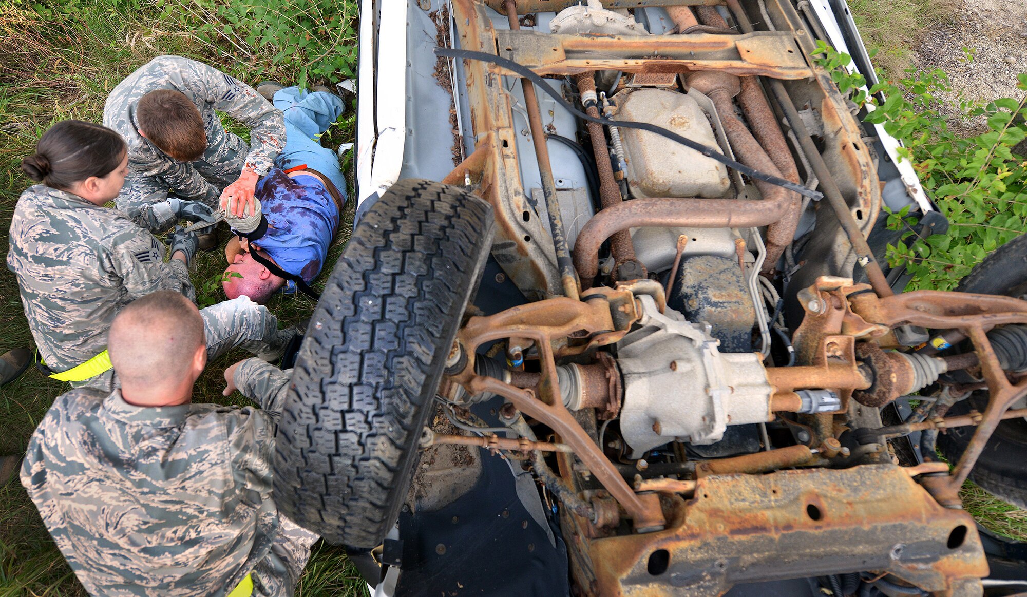 WRIGHT-PATTERSON AIR FORCE BASE, Ohio - Members of the 445 Air Wing treat a casualty during the wing’s massive disaster response exercise held at Calamityville training and research facility in Fairborn, Ohio, Sept. 29. Approximately 400 people took part in the massive exercise. (U.S. Air Force photo/Tech. Sgt. Frank Oliver)