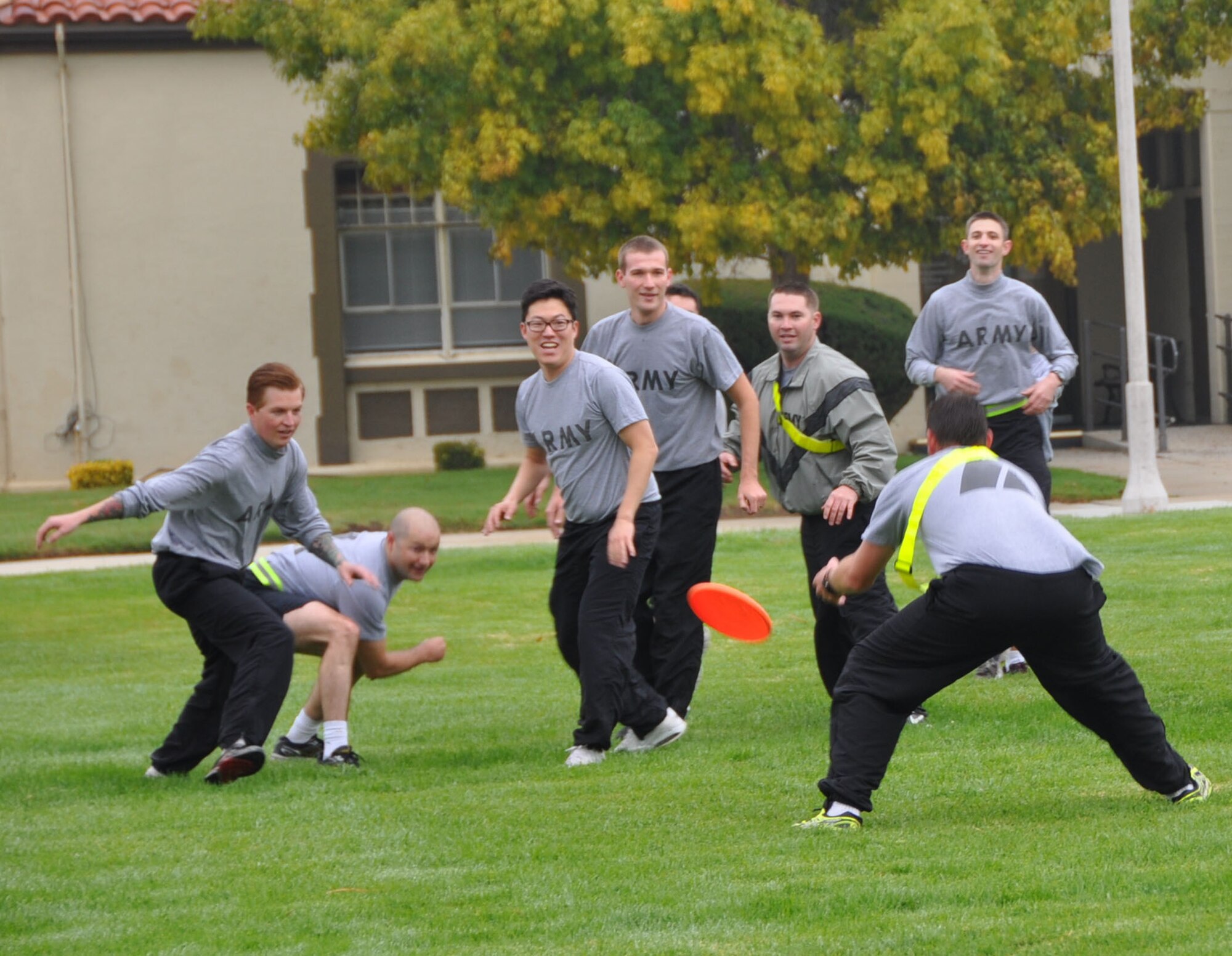 Reservists from the 7230th Medical Support Unit play a high intensity game of Frisbee golf November 3rd, on the March Air Reserve Base parade field to build up their fitness and maintain a high level of unit cohesiveness and Esprit-de-corps. The activity is part of the unit’s on-going commitment to fitness and the Healthy Base Initiative, where the leadership ensures members are keeping up with fitness through military-related "muscle failure" workouts and cardio activities each drill weekend. (U.S. Air Force photo/2nd Lt. Bari Yonkers)