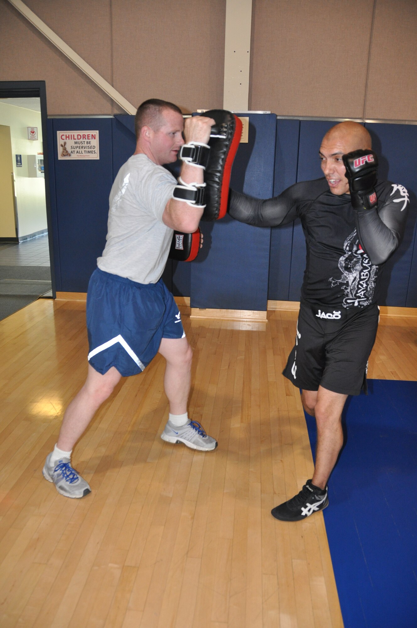 Senior Airman David Adolfo (right) and Senior Airman Corey Quirke, 452nd Civil Engineer Squadron members, spar at the March Air Reserve Base gym to keep fit and agile. Adolfo, who has been participating in Mixed Martial Arts since he was a young boy, learns and teaches vaious martial arts disciplines while incorporating the warrior ethos into all areas of his life in and out of the ring.