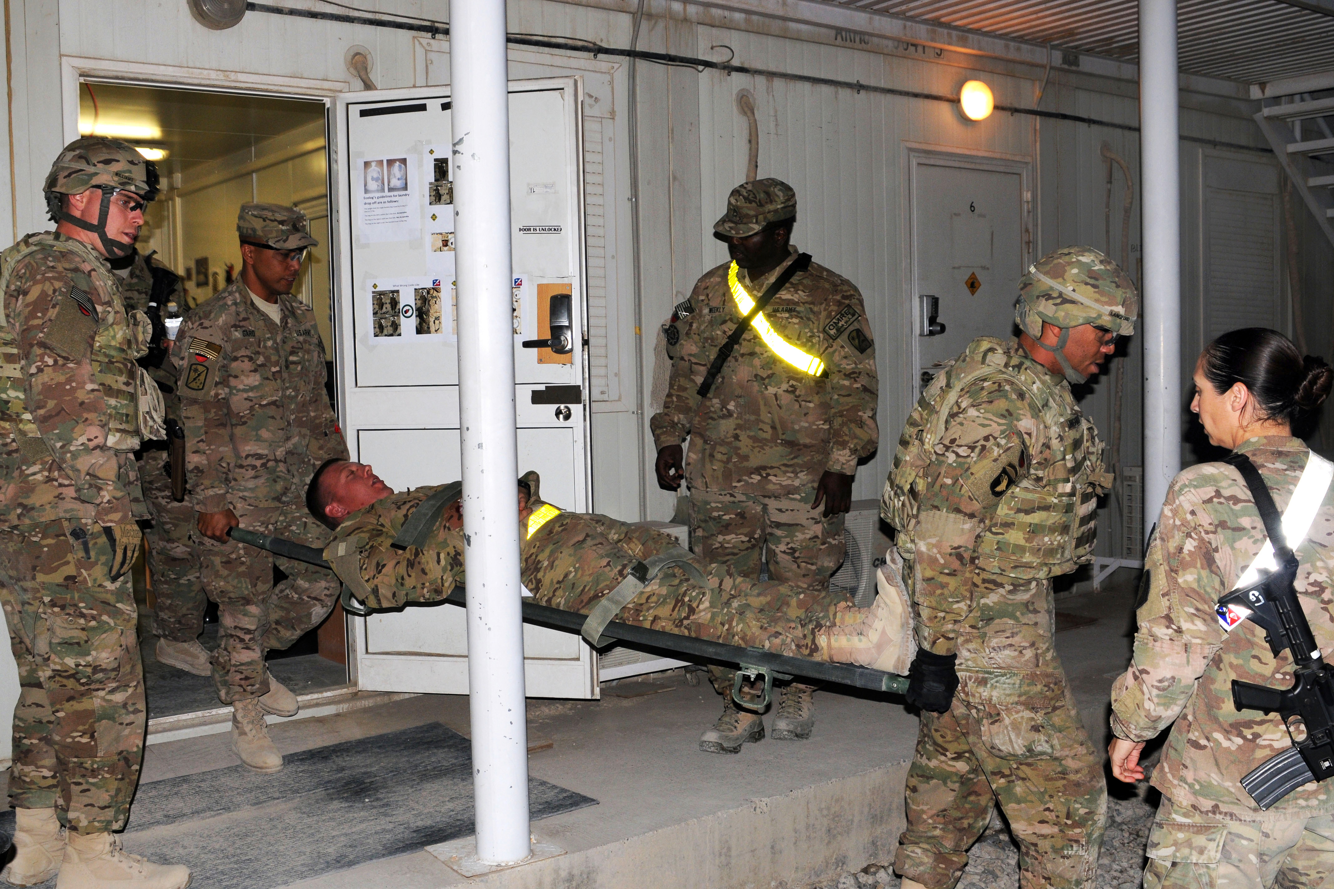 U S Soldiers Take A Simulated Casualty To A Triage Station During A Mass Casualty Exercise On