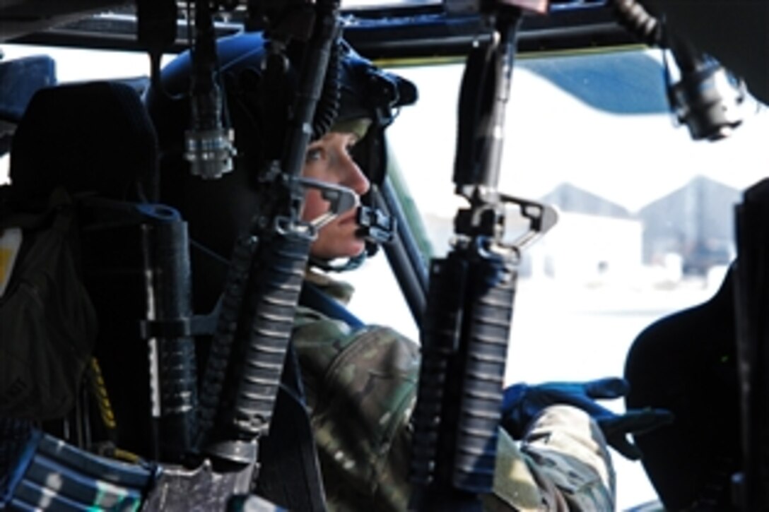 U.S. Army Capt. Lisa Klekowski prepares the cockpit of her U.S. Army UH-60M Black Hawk helicopter before conducting a personnel movement mission on Kabul International Airport, Afghanistan, Dec. 4, 2013. Klekowski is a pilot assigned to Company C, 2nd Battalion Assault, 10th Combat Aviation Brigade. 